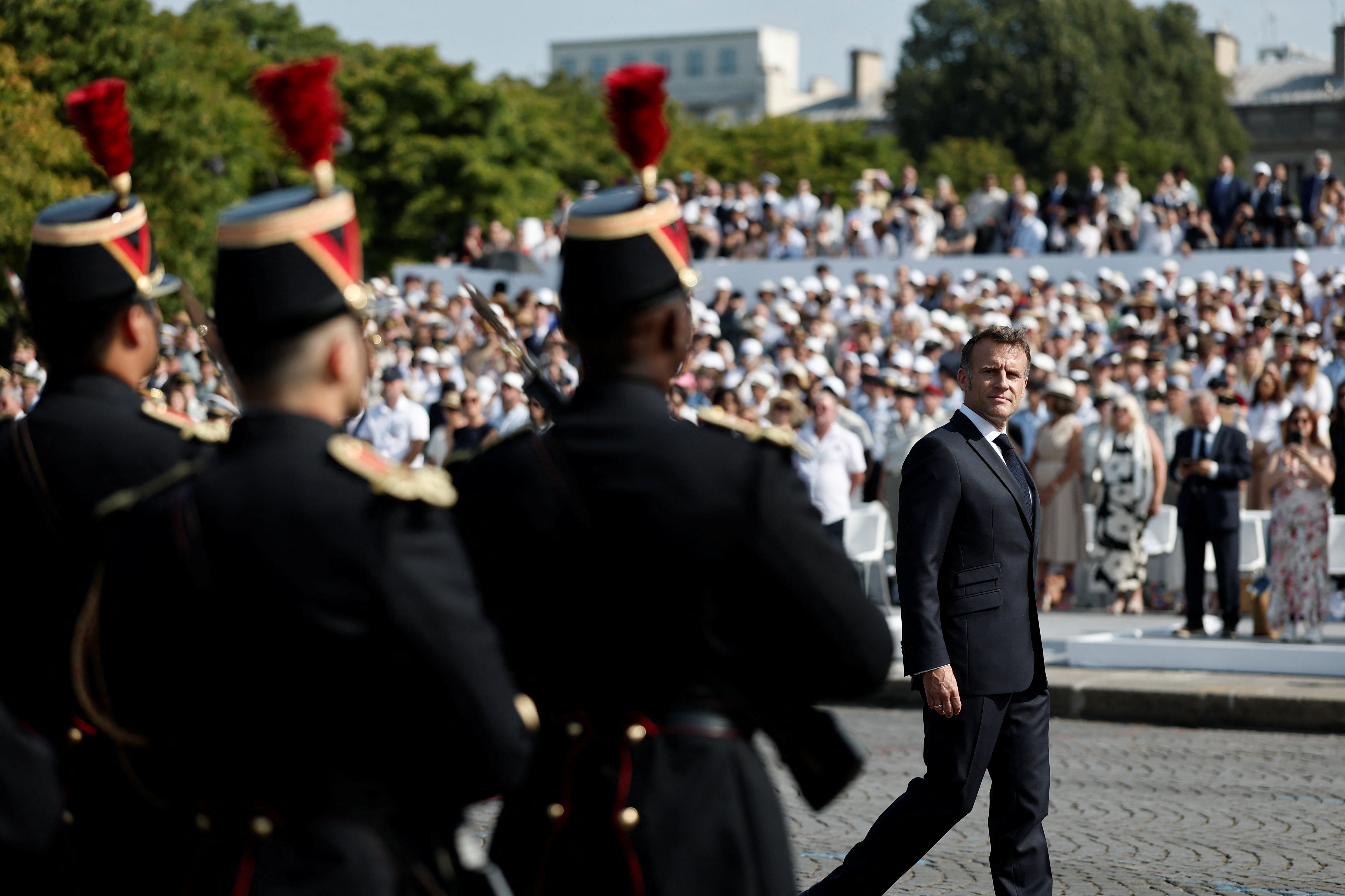 French President Emmanuel Macron reviews the troops on the Place de la Concorde during the annual Bastille Day military parade in Paris, France, July 14, 2026. REUTERS/Benoit Tessier/Pool