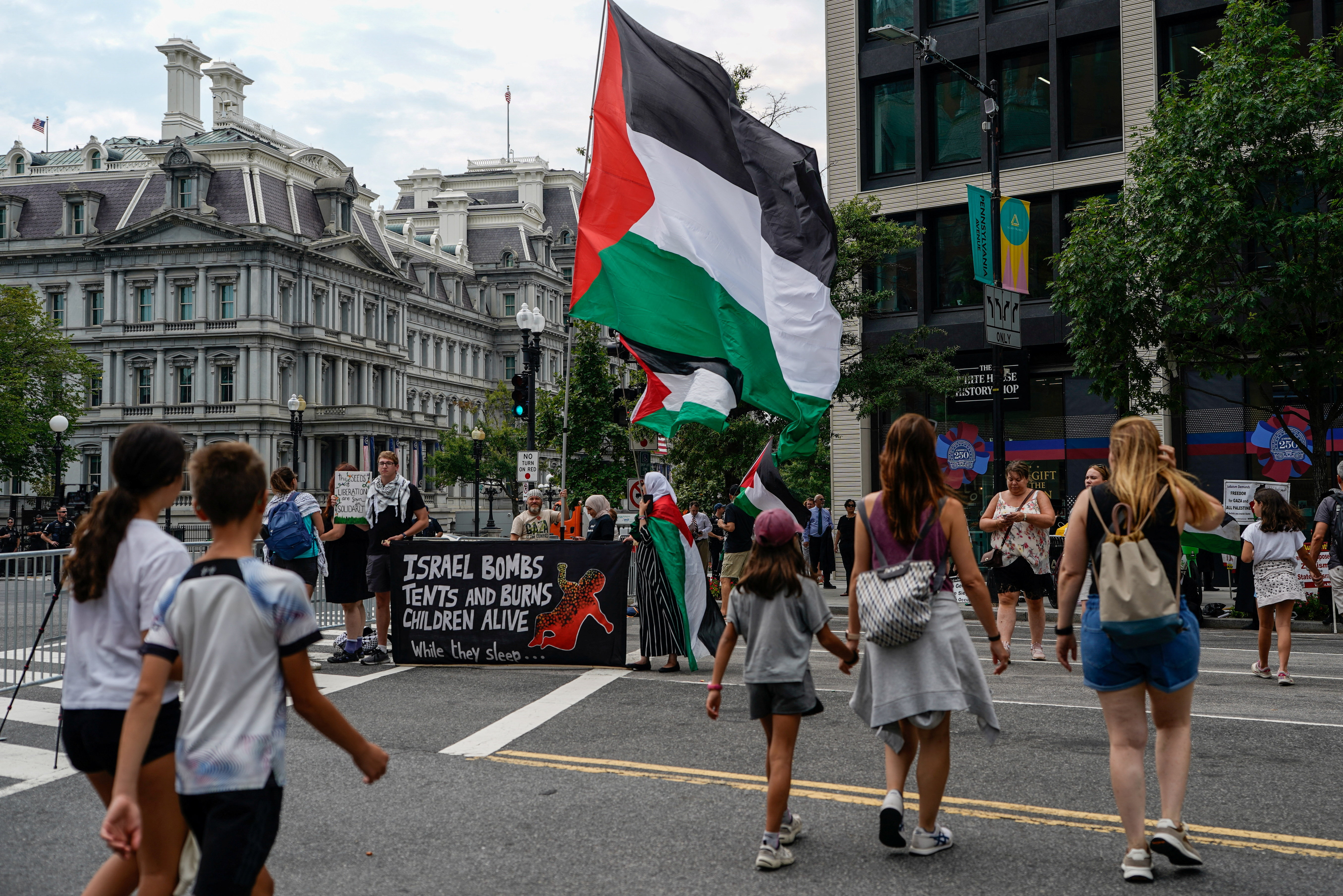 People take part in a protest against Israeli Prime Minister Benjamin Netanyahu near the White House, as Netanyahu meets U.S. President Donald Trump