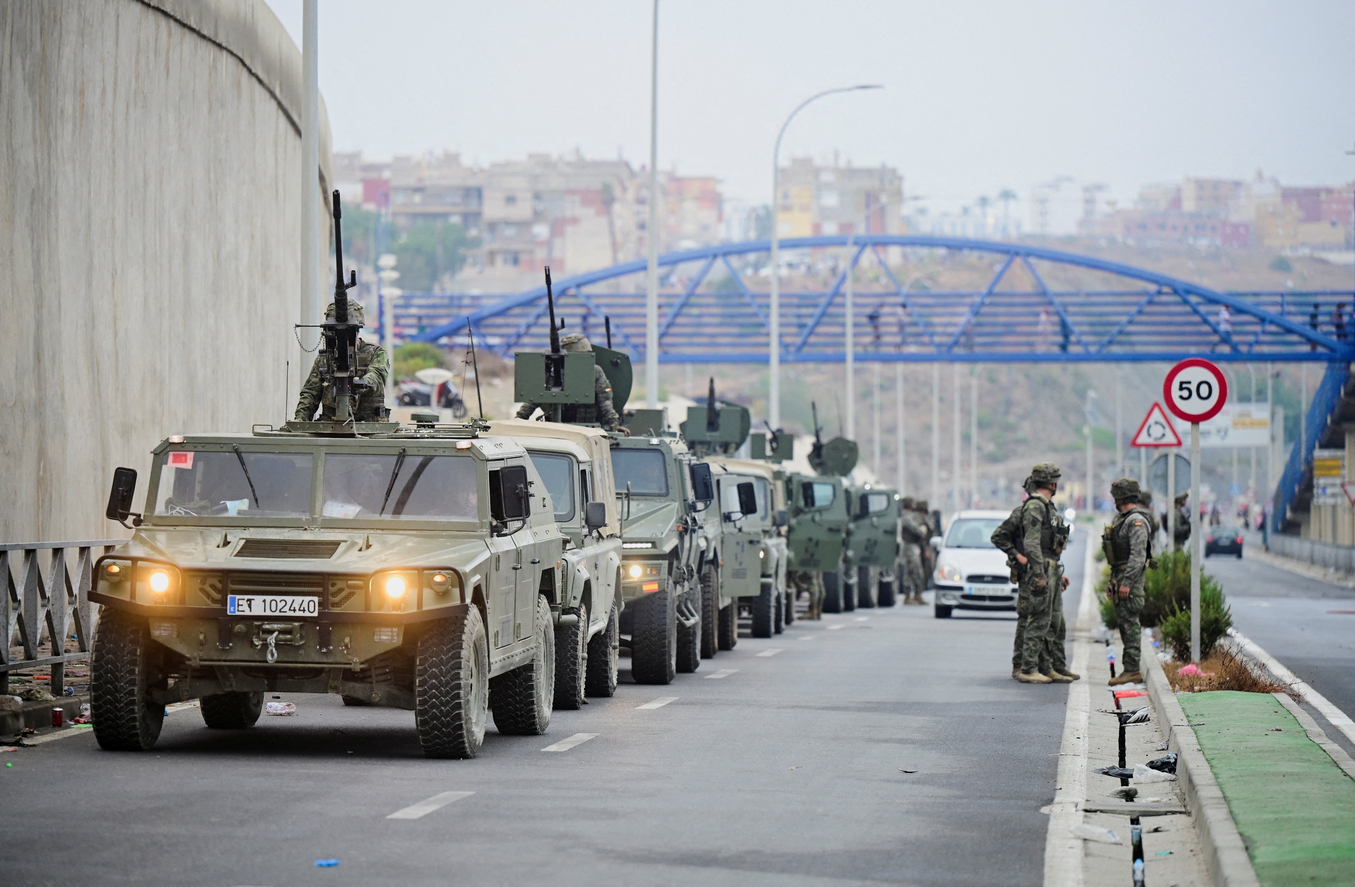 Spanish Soldiers patrol at the Spanish-Moroccan border in Ceuta, Spain, as migrants try to cross the border by the sea, July 31, 2026. REUTERS/Fabian Bimmer