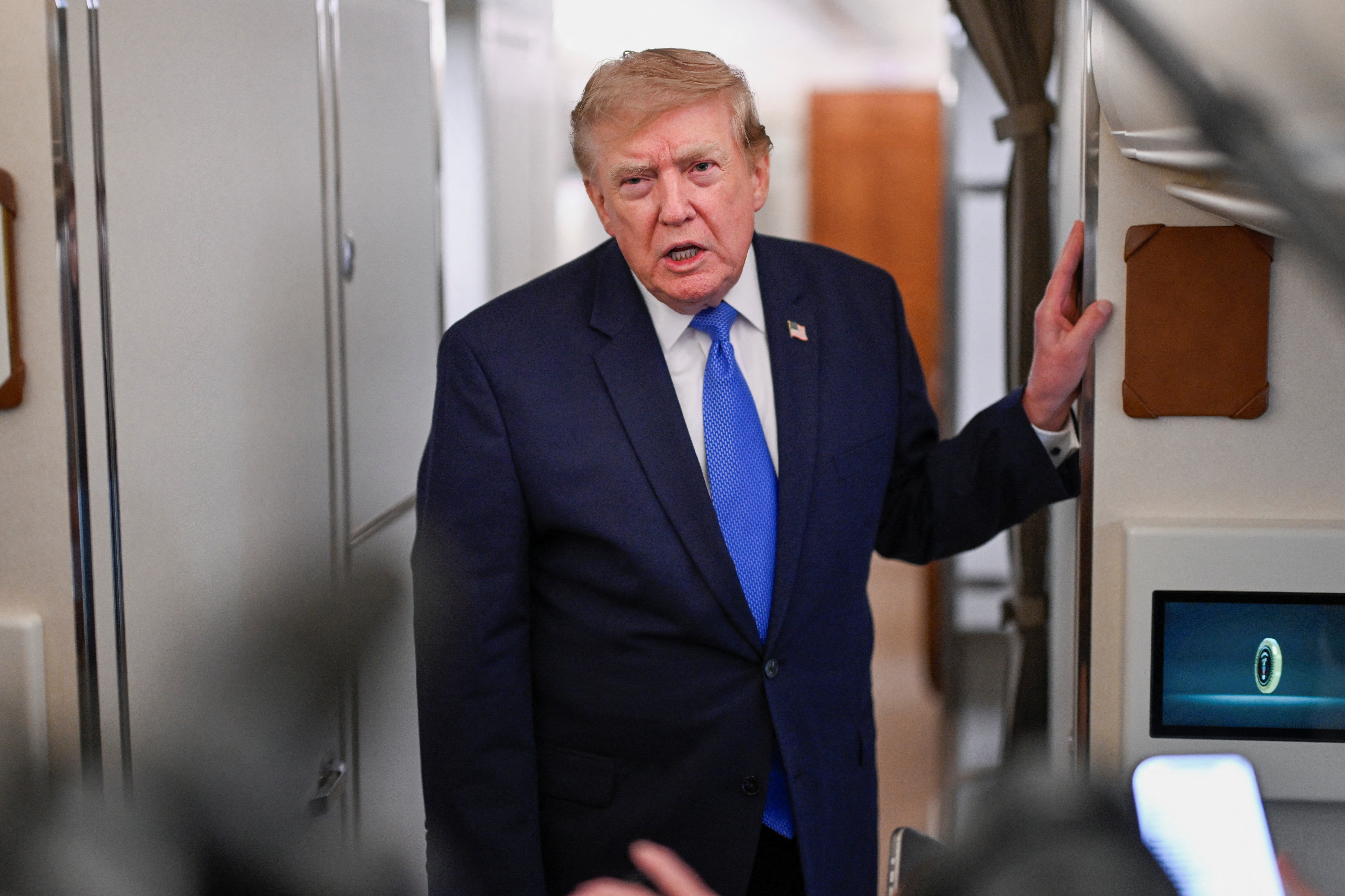 U.S. President Donald Trump speaks to the media aboard Air Force One en route to Joint Base Andrews, in Maryland, U.S., August 2, 2026. REUTERS/Daniel Heuer