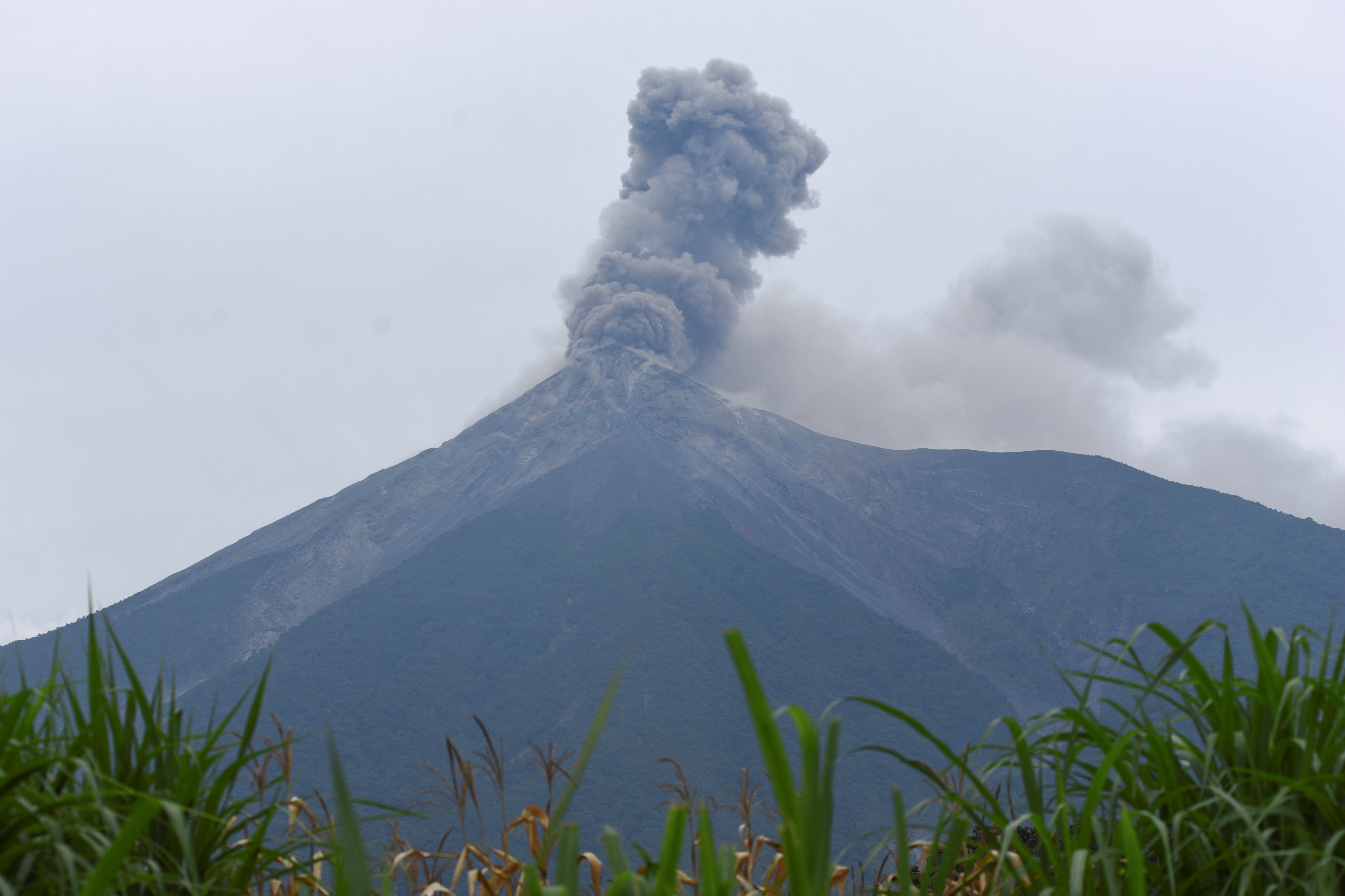 Guatemala's Fuego volcano erupts, spewing ash after authorities raised the alert level to orange, as seen from Santa Lucia Cotzumalguapa, Guatemala, August 4, 2026.