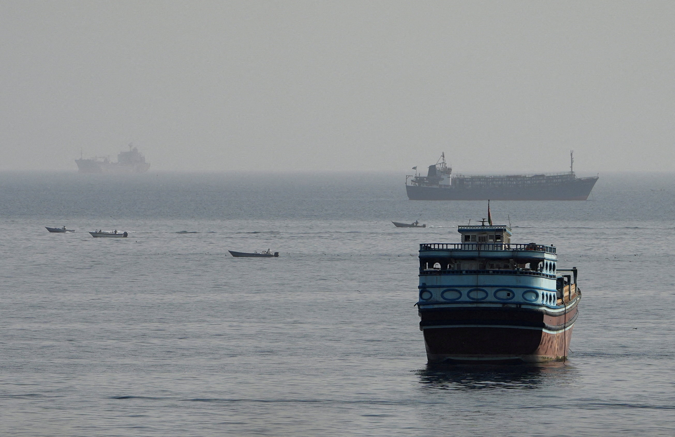 FILE PHOTO: Vessels in the Strait of Hormuz, as seen from Musandam, Oman, August 3, 2026. REUTERS/Stringer/File Photo