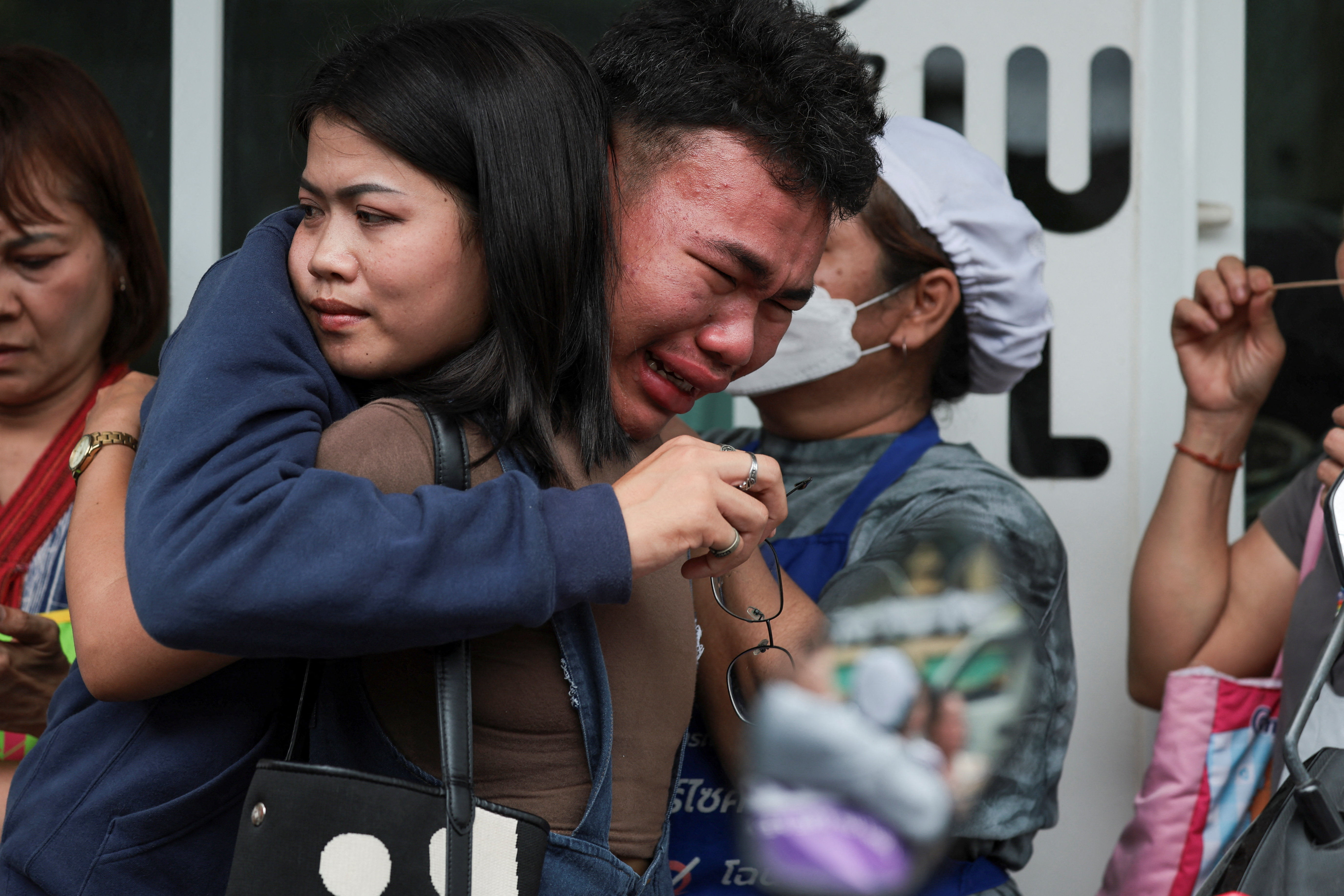 A student reacts after evacuating from Debsirin Nonthaburi School, following a shooting incident at the school, in Bang Kruai district in Nonthaburi province on the outskirts of Bangkok