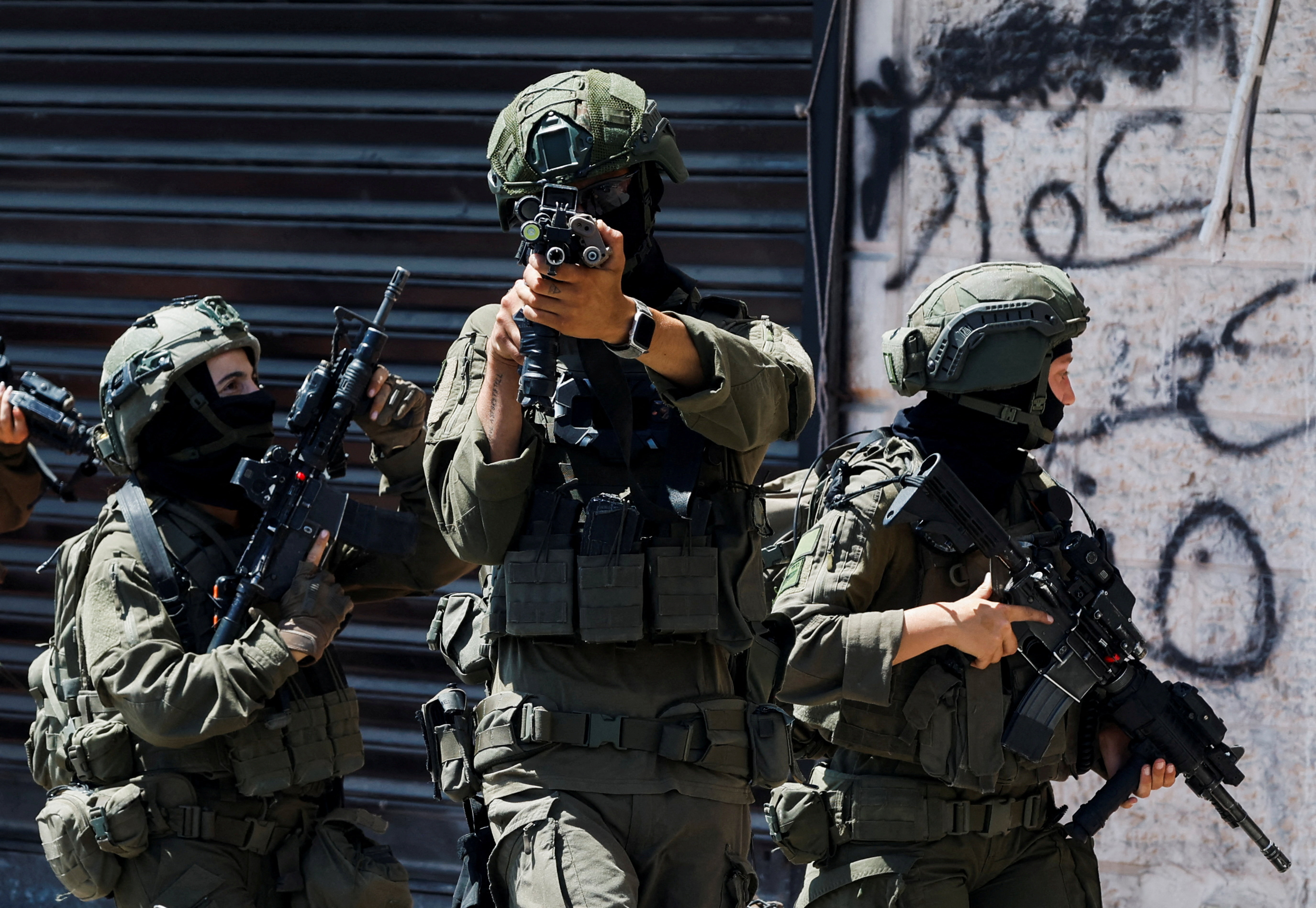 Israeli forces take part in a raid in Qalandia refugee camp, in the Israeli-occupied West Bank, August 5, 2026.