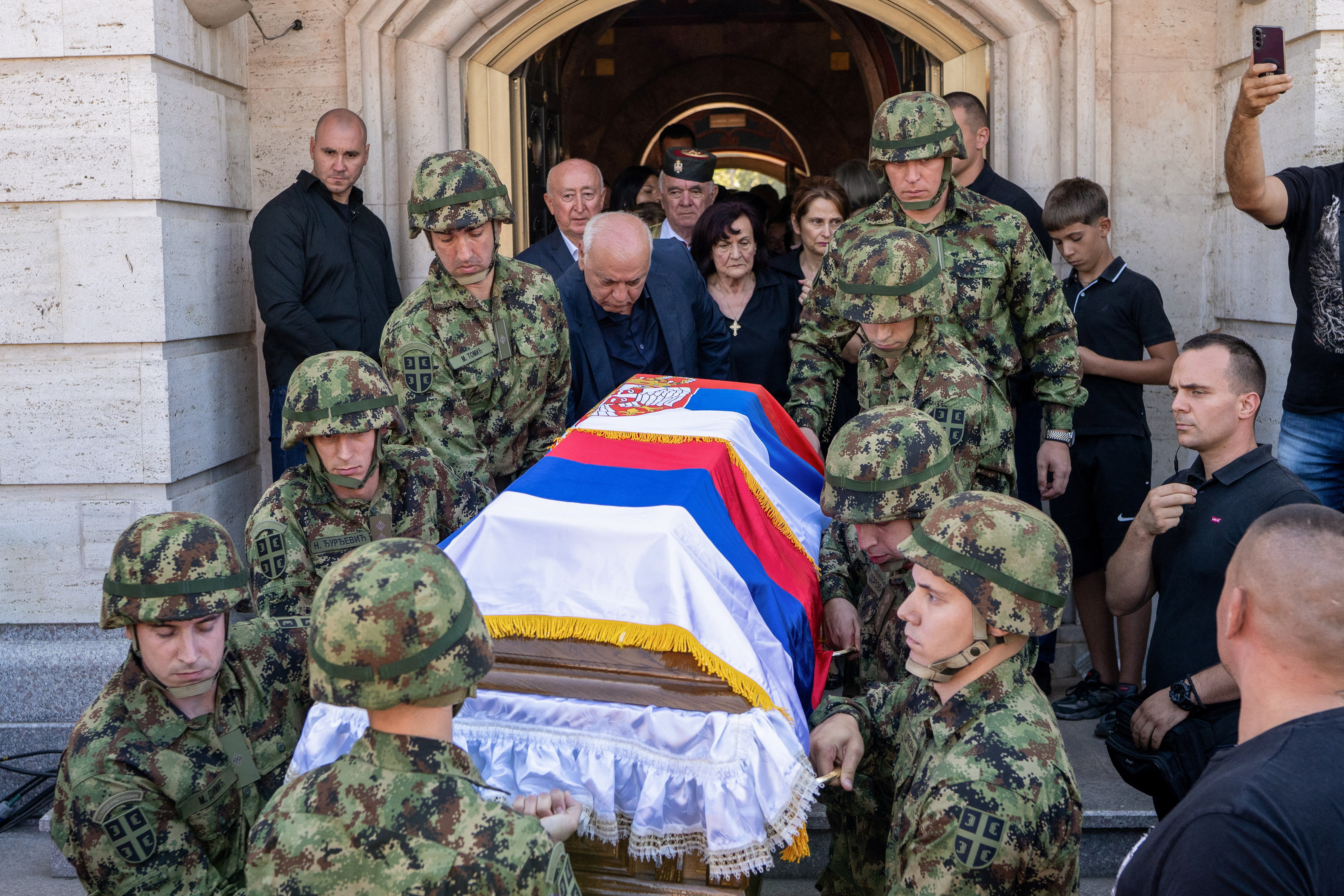 Serbian army soldiers carry the coffin of former Bosnian Serb wartime general Ratko Mladic outside the Church of St. Luke before burial, in Belgrade, Serbia, September 7, 2026.