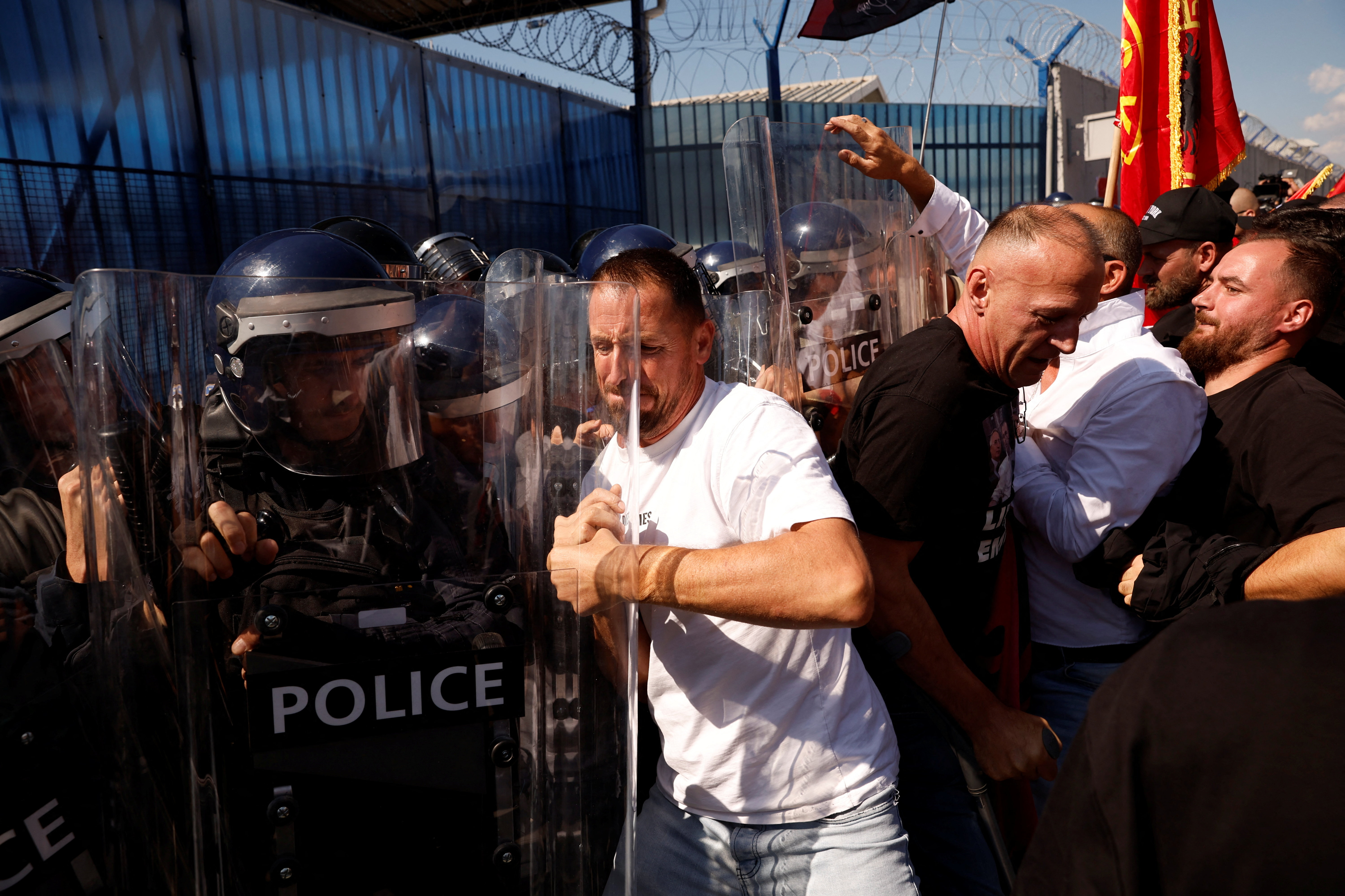 Protesters scuffle with riot police outside the European Union Rule of Law Mission in Kosovo (EULEX) headquarters in Pristina, Kosovo September 16, 2026. REUTERS/Valdrin Xhemaj