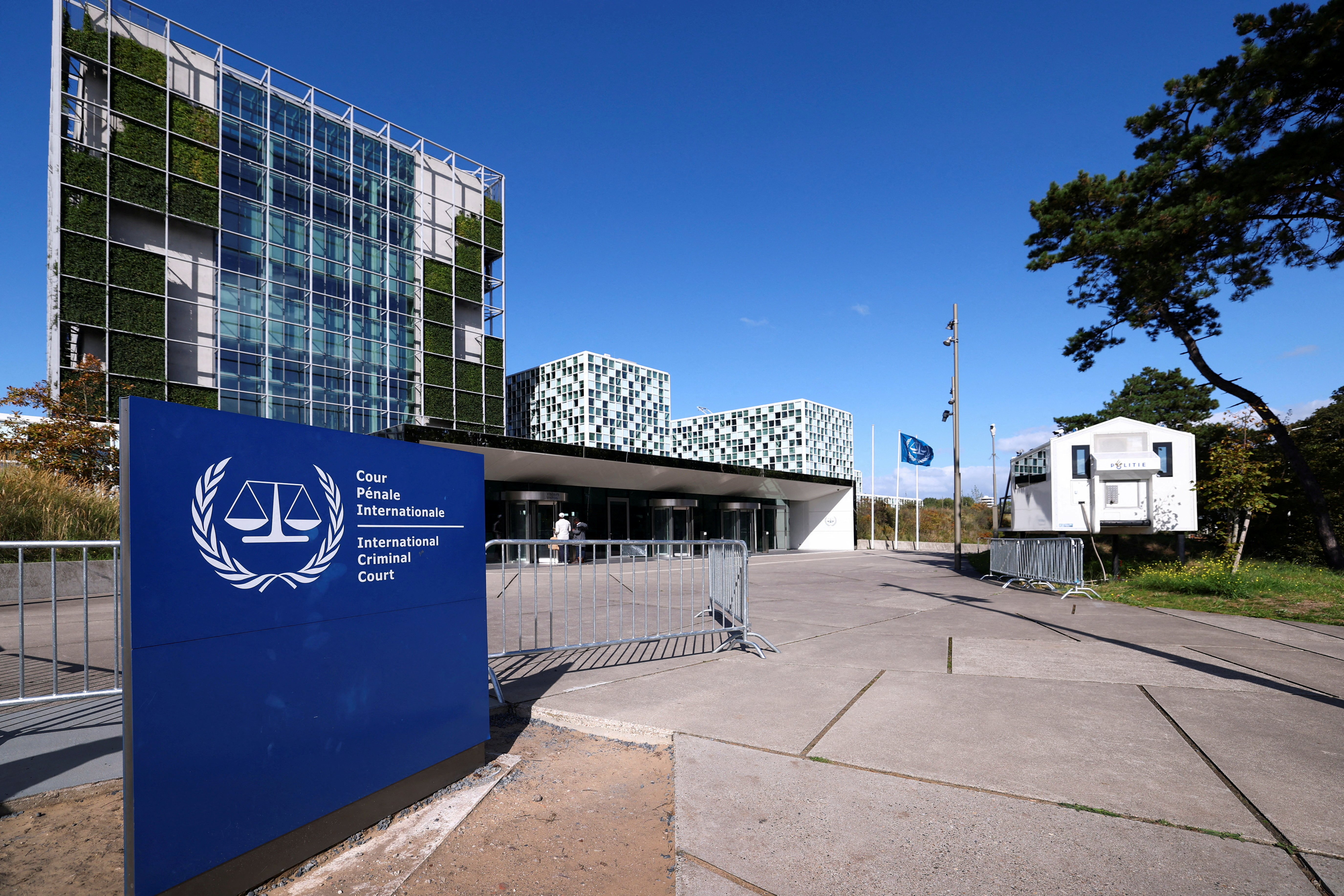 People stand outside the International Criminal Court in The Hague, Netherlands, September 22, 2025.