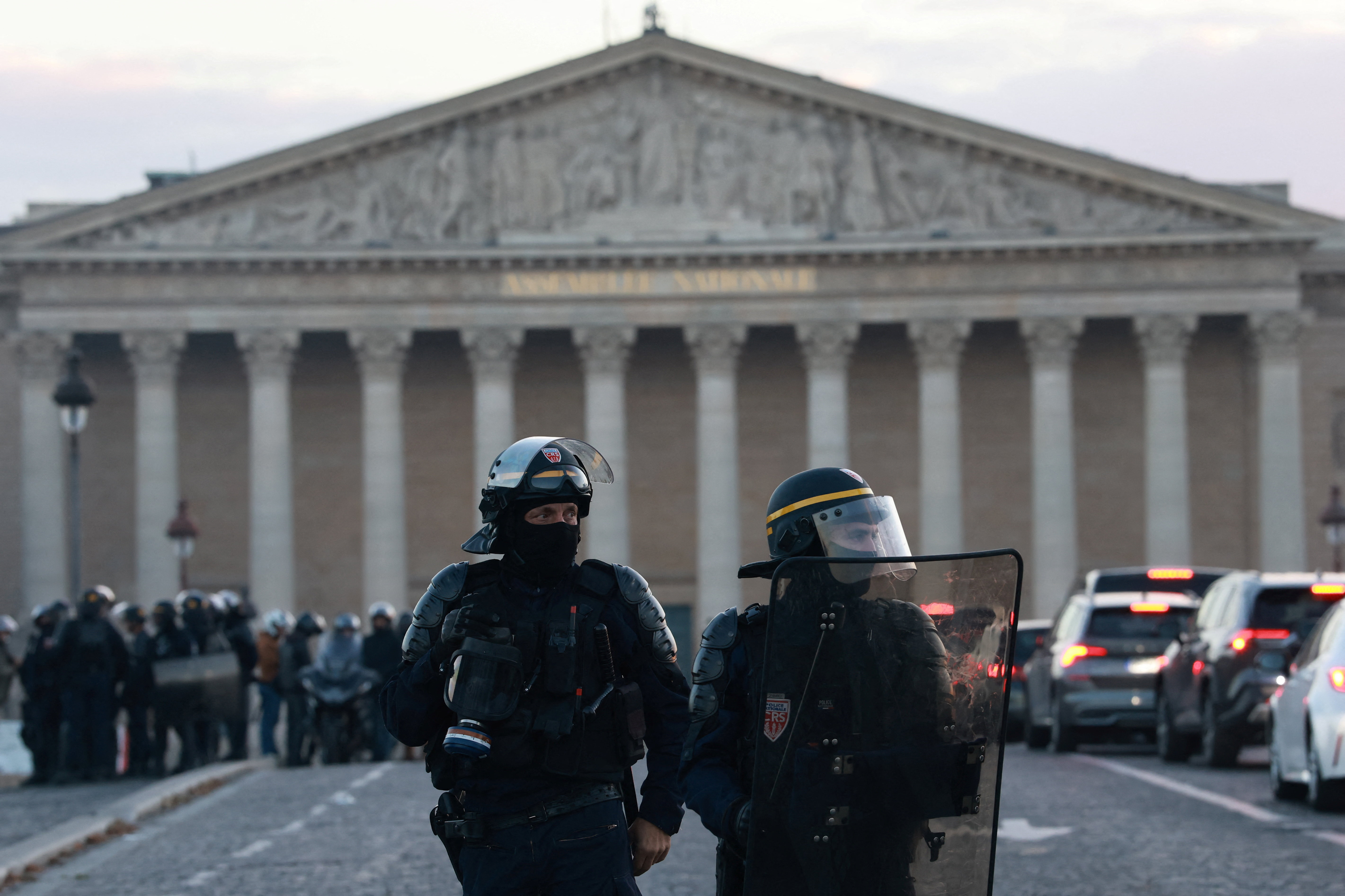 French riot police secure the area near the National Assembly amid clashes with protesters during a day of demonstrations against the cost of living and rising fuel prices in Paris as part of nationwide protests called by the "Yellow Vests" movement