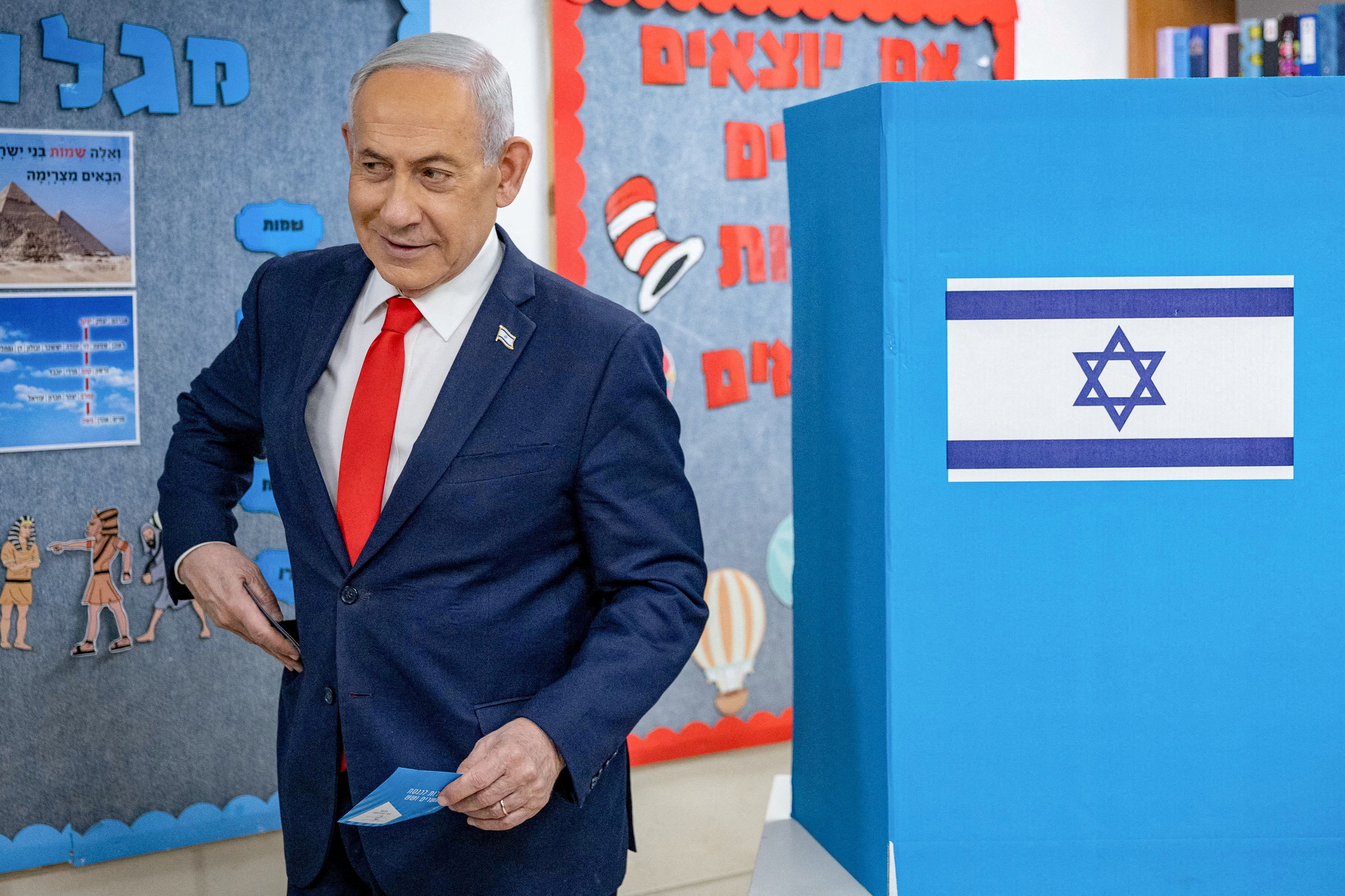 Israel's Prime Minister Benjamin Netanyahu reacts after filling out his ballot before voting at a polling station in Jerusalem on October 27, 2026.