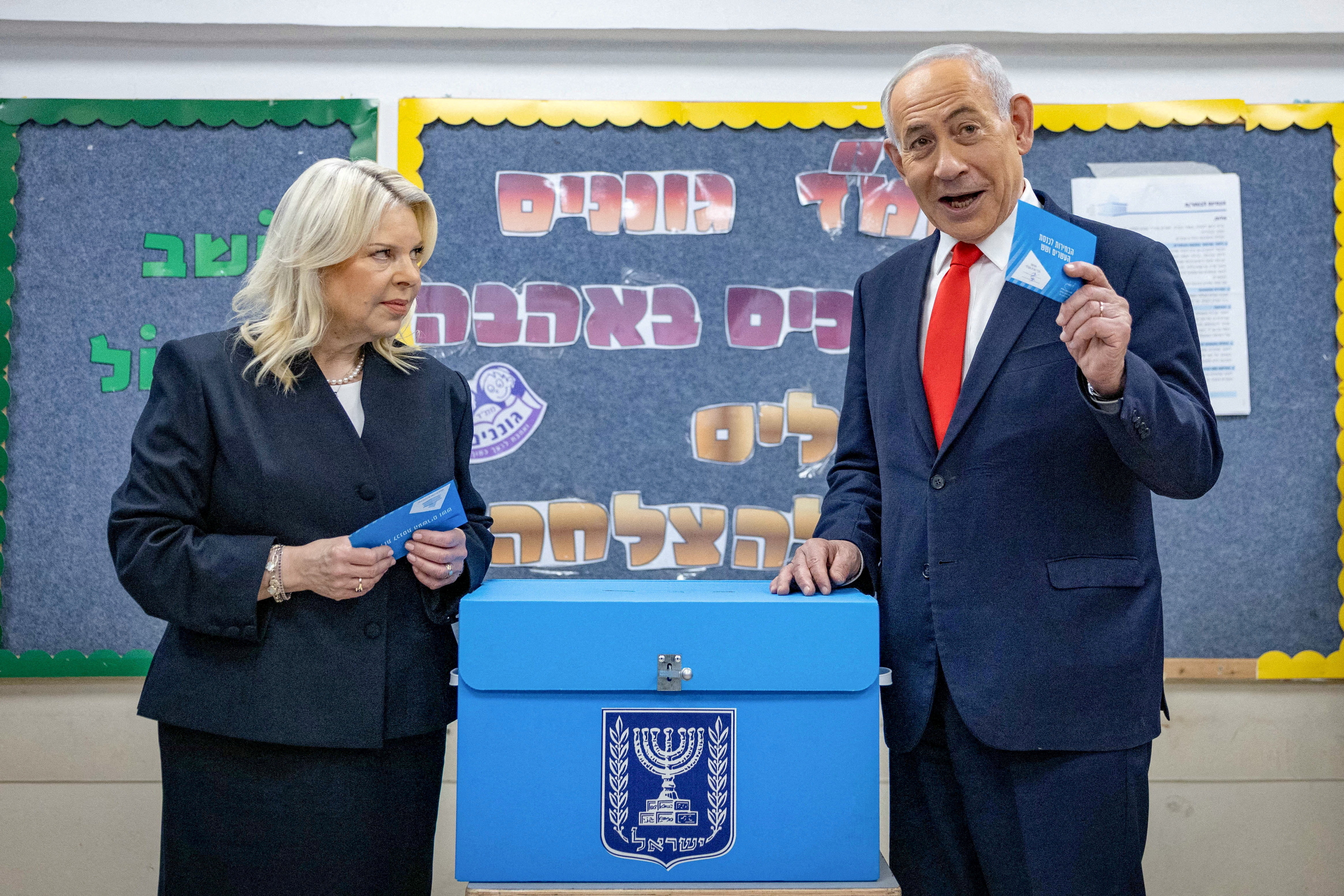 FILE PHOTO: Israel's Prime Minister Benjamin Netanyahu and his wife Sara prepare to vote at a polling station in Jerusalem on October 27, 2026