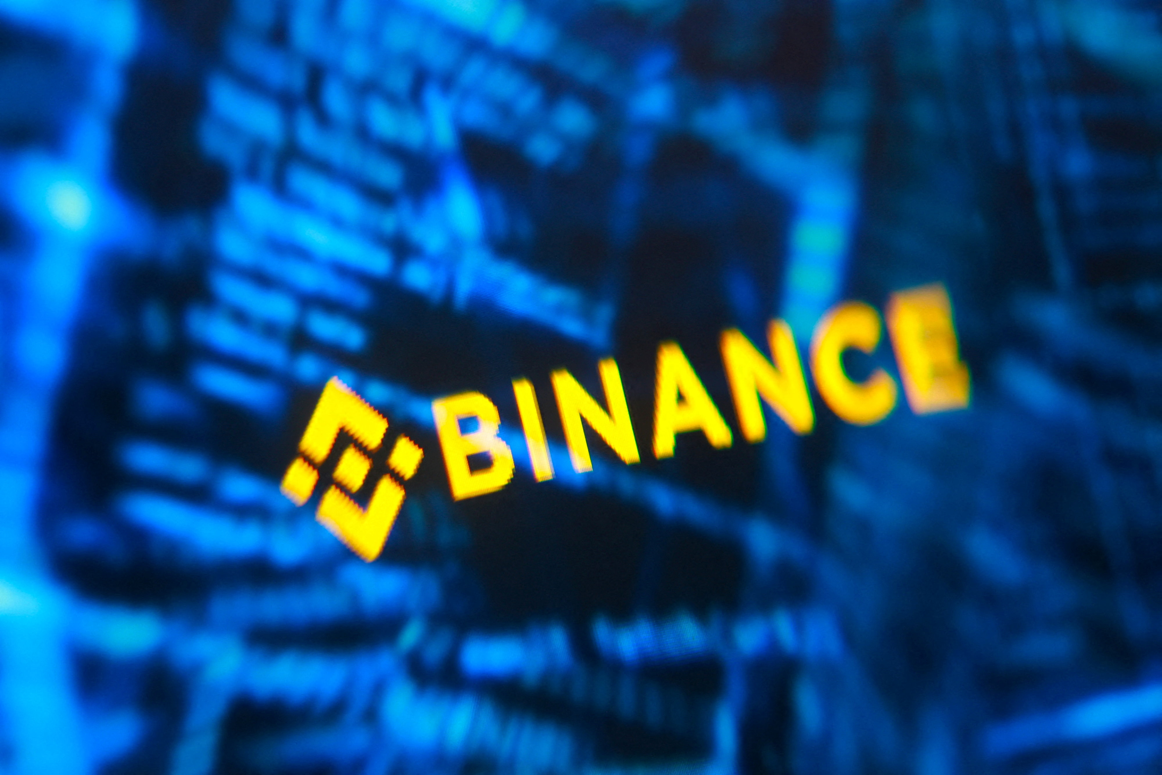 Binance logo and hacker code are seen in this illustration taken October 30, 2026. REUTERS/Dado Ruvic/Illustration