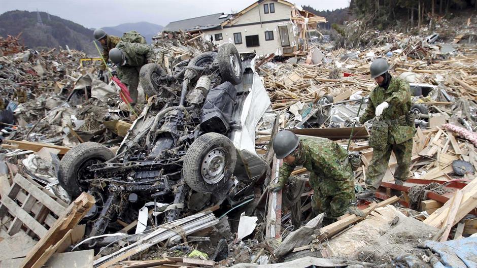 2016-03-09T092220Z_903602228_GF10000337776_RTRMADP_3_JAPAN-DISASTER-GRIEF