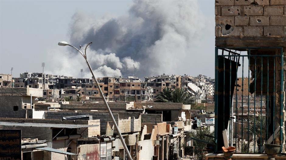 2017-10-12T173521Z_1064914299_RC1ED6CD2CB0_RTRMADP_3_MIDEAST-CRISIS-SYRIA-RAQQA