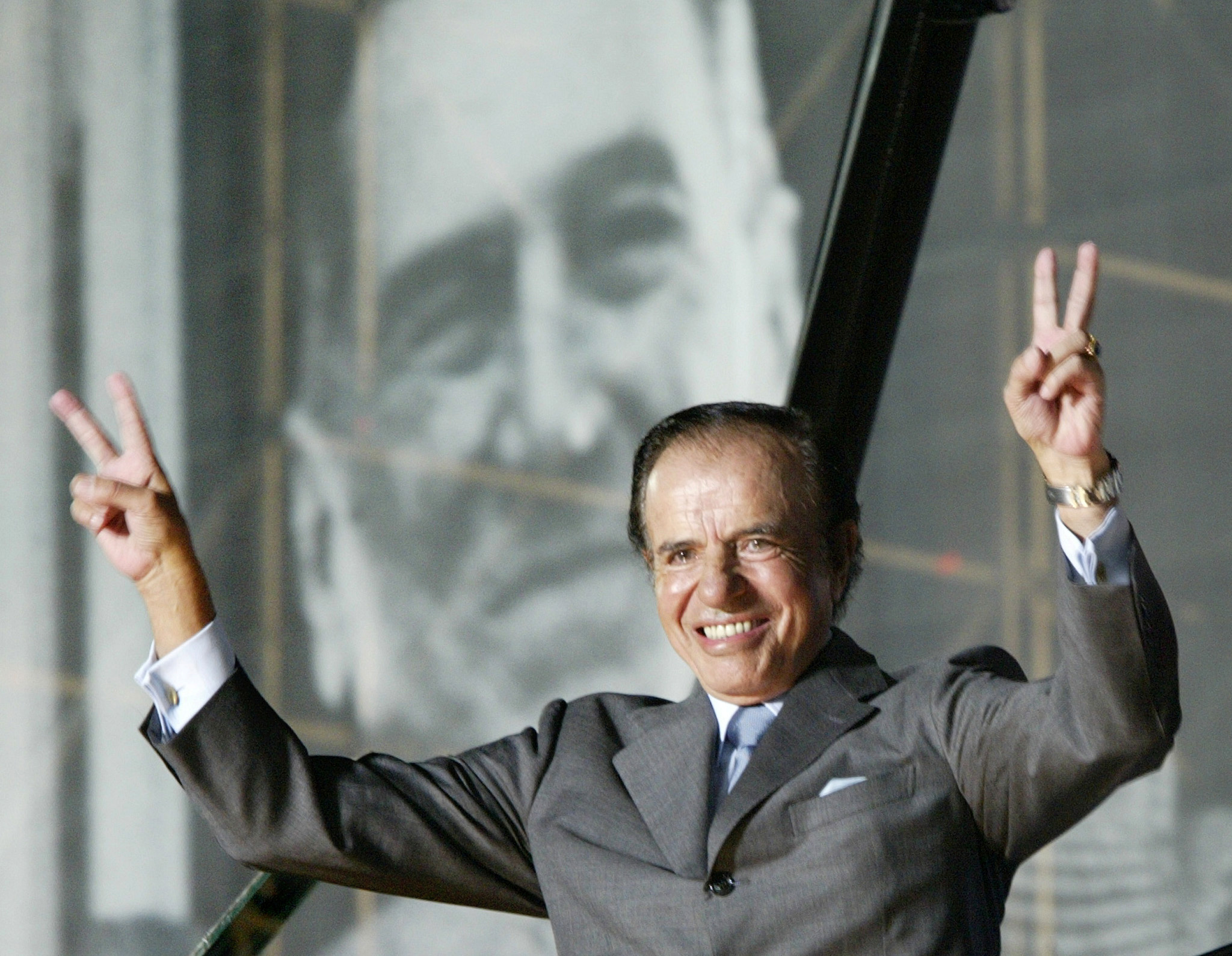 FILE PHOTO: Argentine presidential candidate Carlos Menem waves to thousands of followers in River Plate Stadium in Buenos Aires