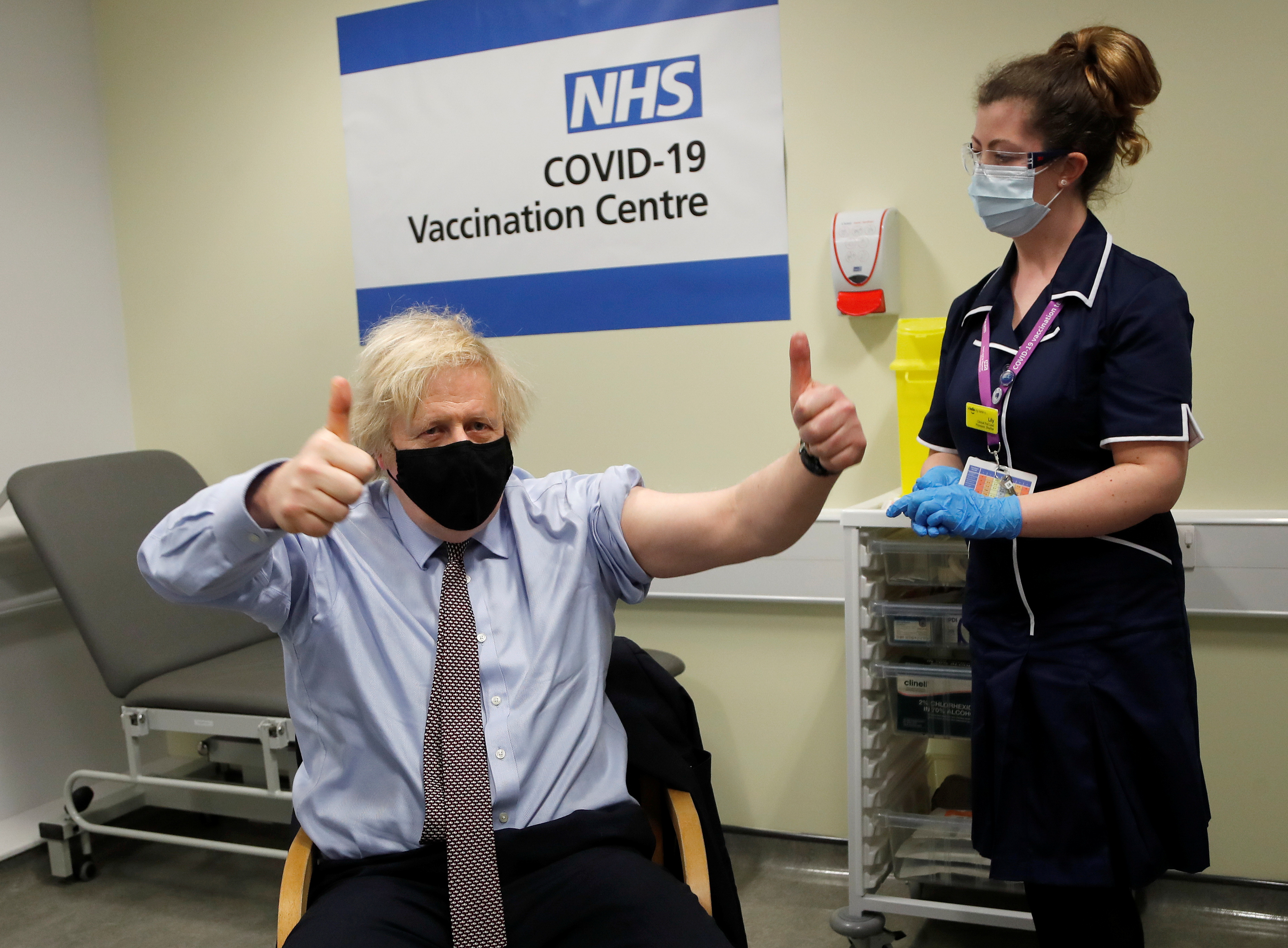 British Prime Minister Boris Johnson receives a dose of the Oxford/AstraZeneca COVID-19 vaccine in London