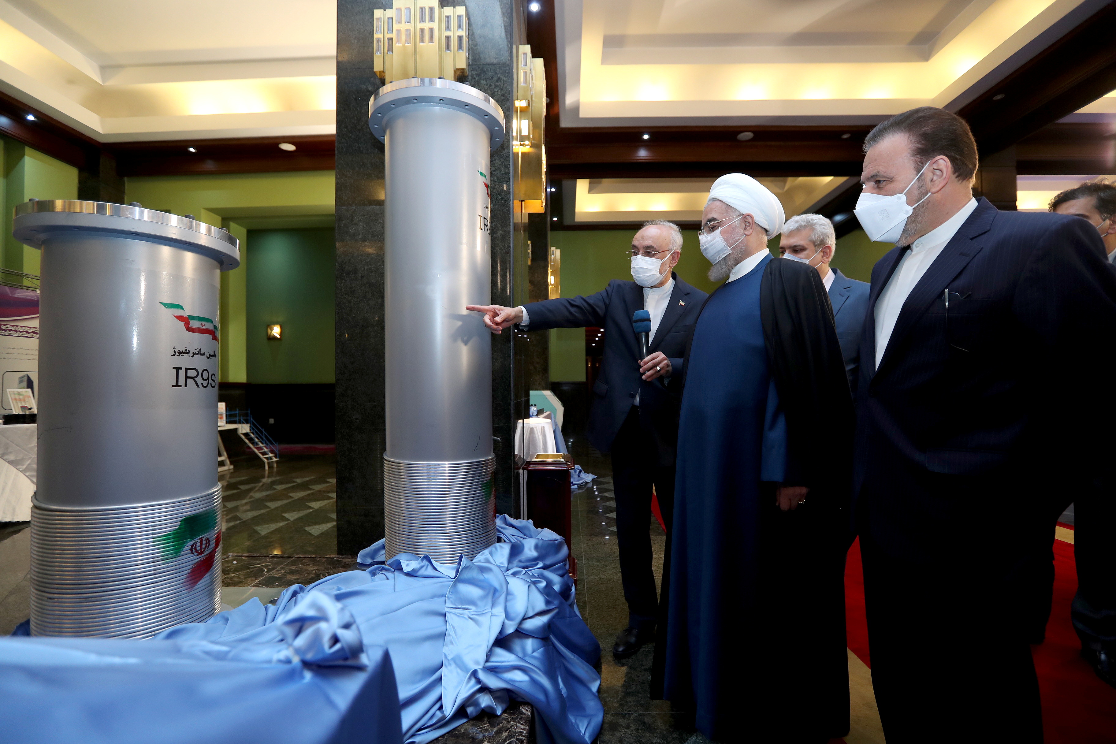 Iranian President Hassan Rouhani reviews Iran's new nuclear achievements during Iran's National Nuclear Energy Day in Tehran