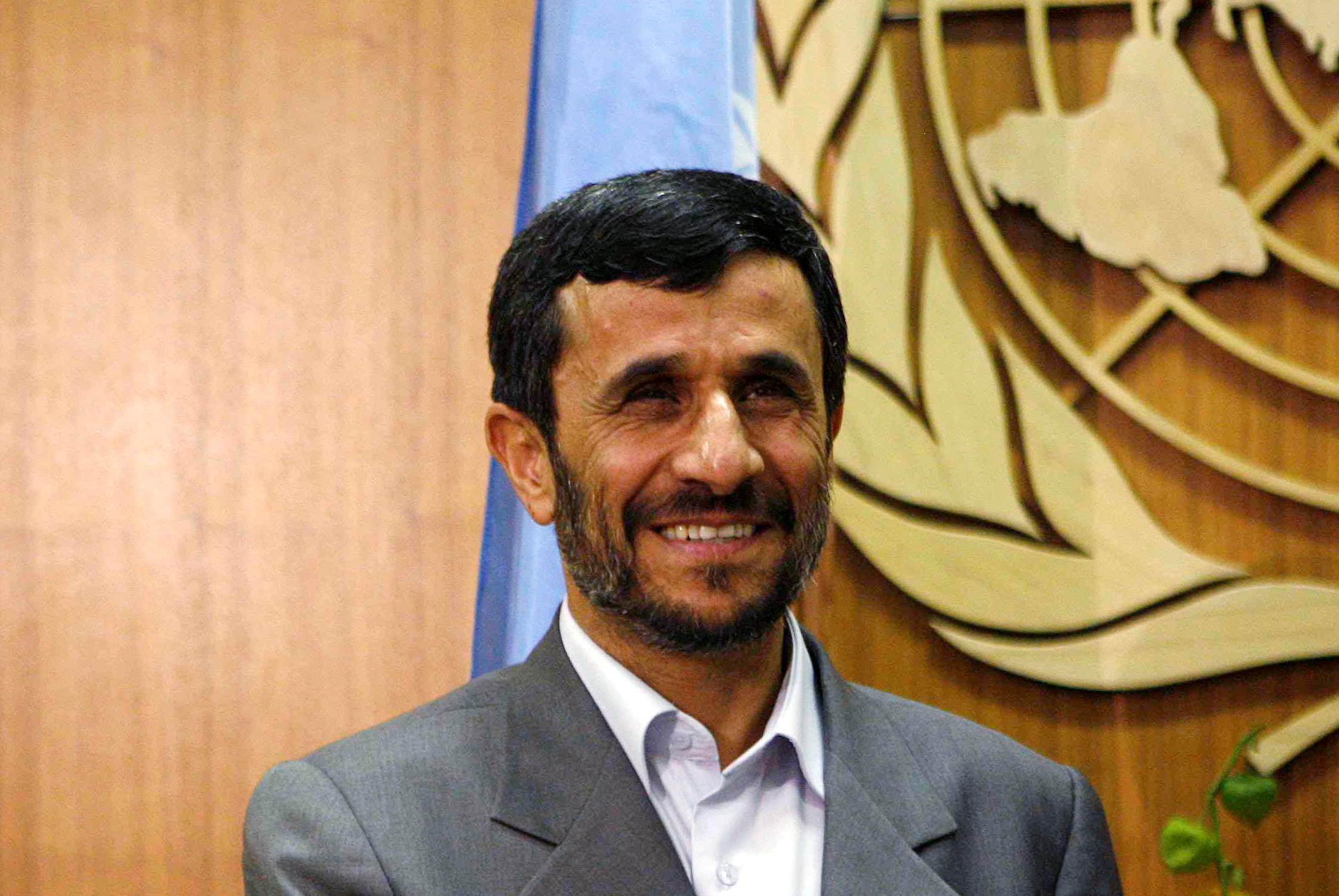 FILE PHOTO: Iran's then President Mahmoud Ahmadinejad smiles as he meets with United Nations Secretary-General Ban Ki-moon at the United Nations in New York