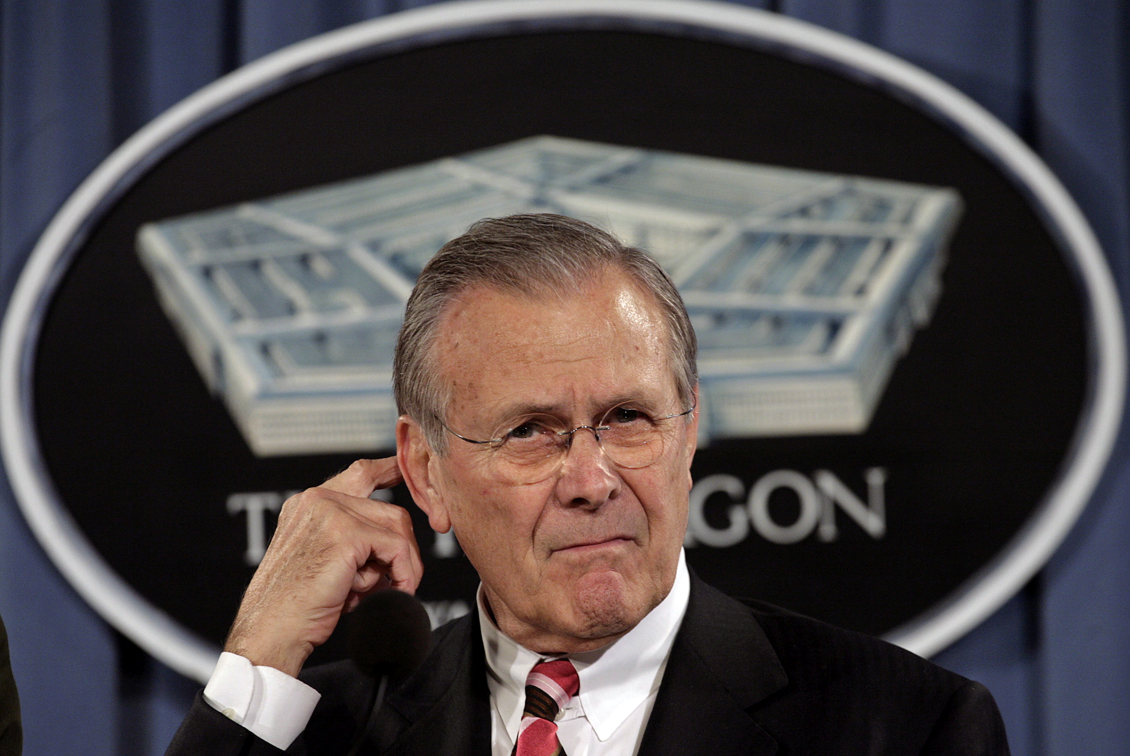 FILE PHOTO: Secretary of Defense Rumsfeld speaks during news briefing at Pentagon