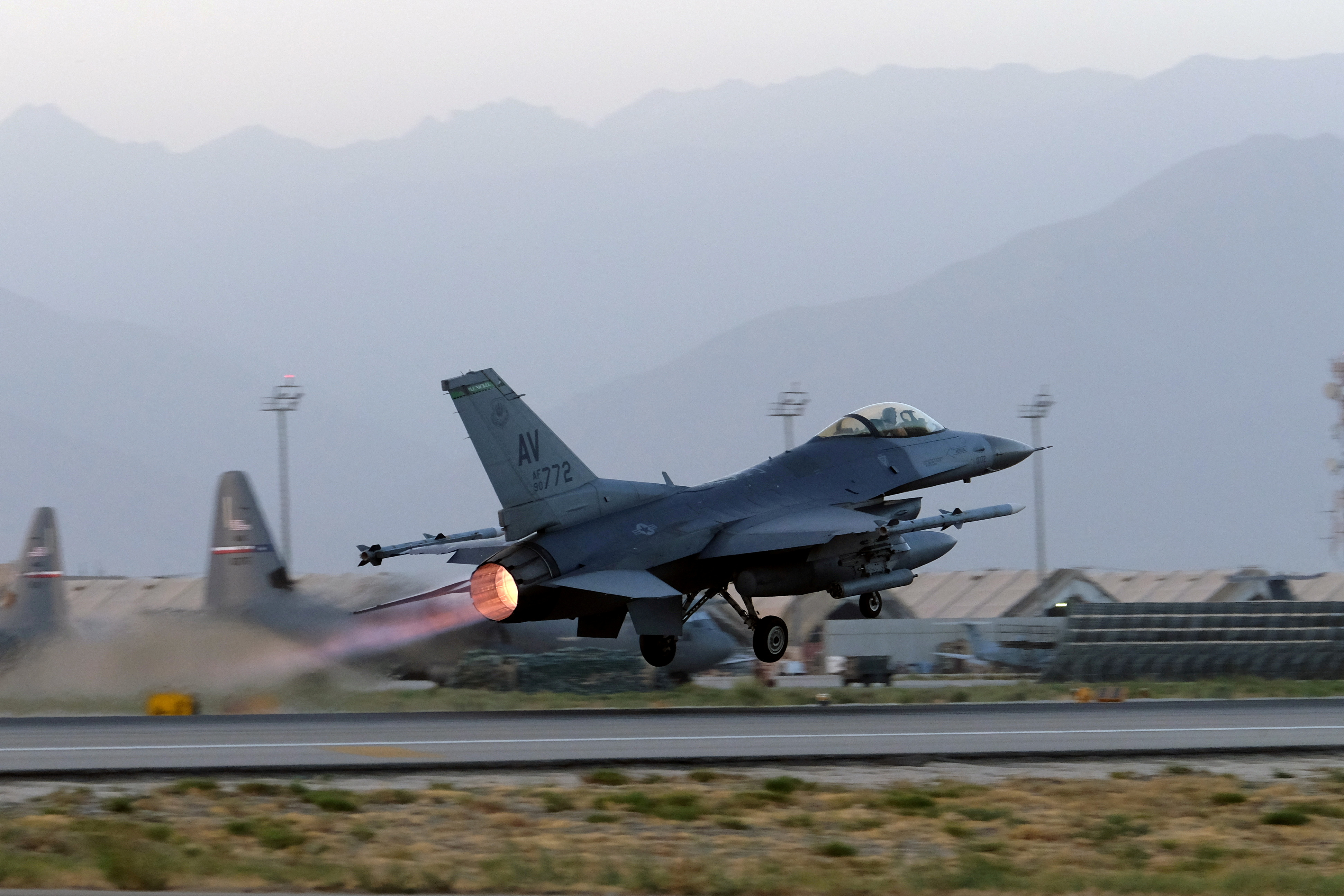 FILE PHOTO: A U.S. Air Force F-16 Fighting Falcon aircraft takes off for a nighttime mission at Bagram Airfield