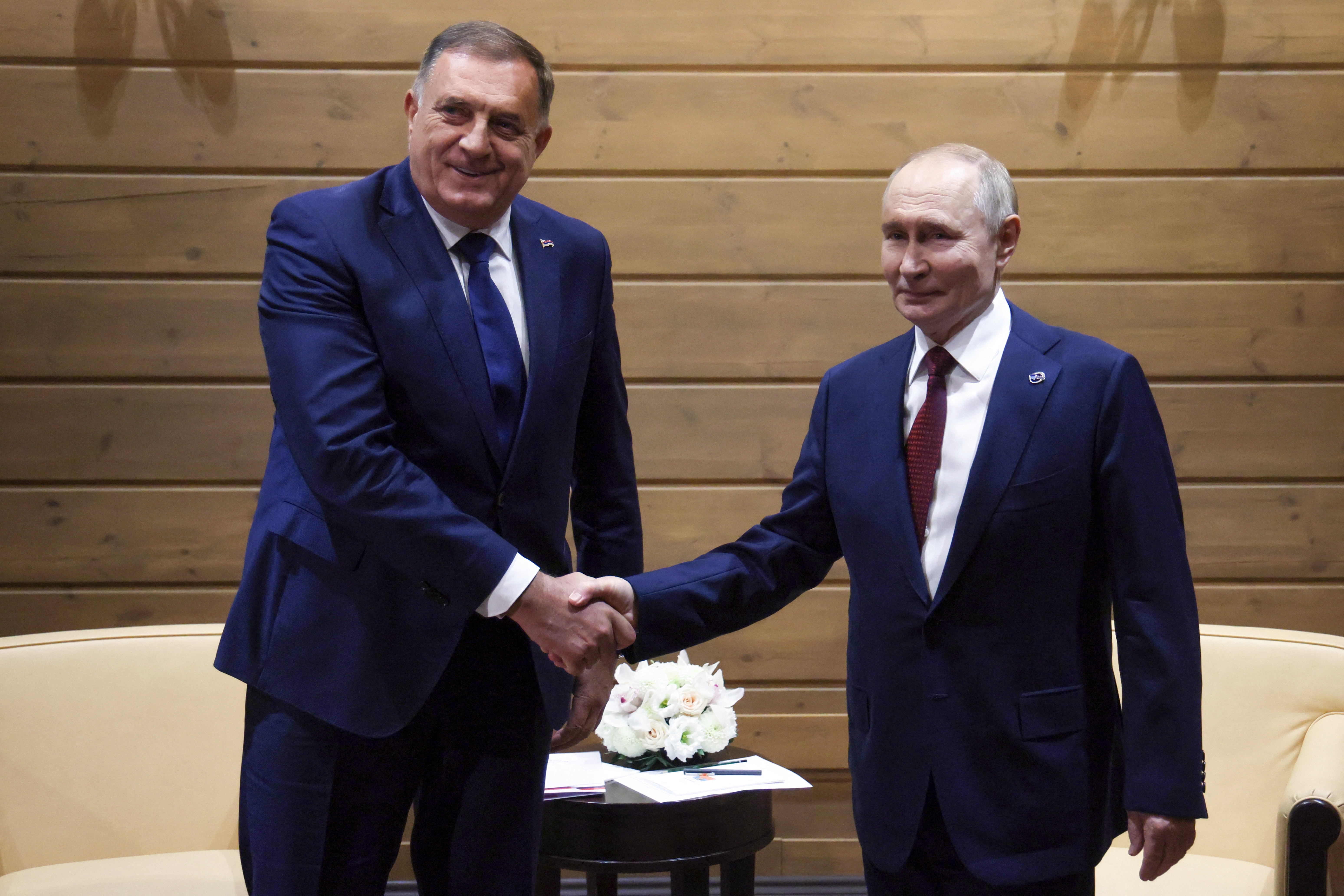 In this pool photograph distributed by the Russian state agency Sputnik, Russia's President Vladimir Putin meets with Bosnian Serb leader Milorad Dodik in Sochi on October 2, 2025. (Photo by Mikhail METZEL / POOL / AFP)