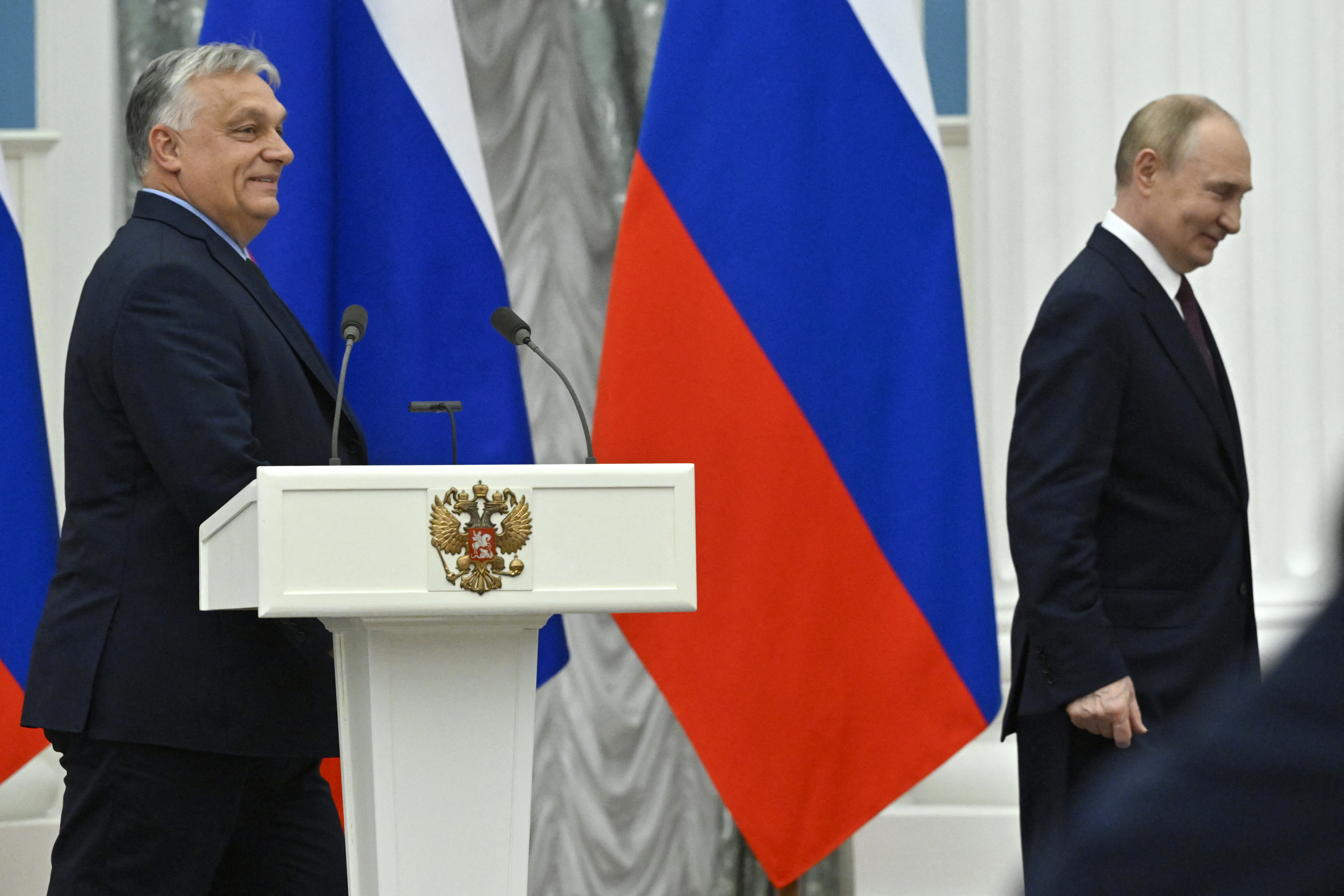 Russia's President Vladimir Putin and Hungary's Prime Minister Viktor Orban leave after delivering a joint press statement following their talks at the Kremlin