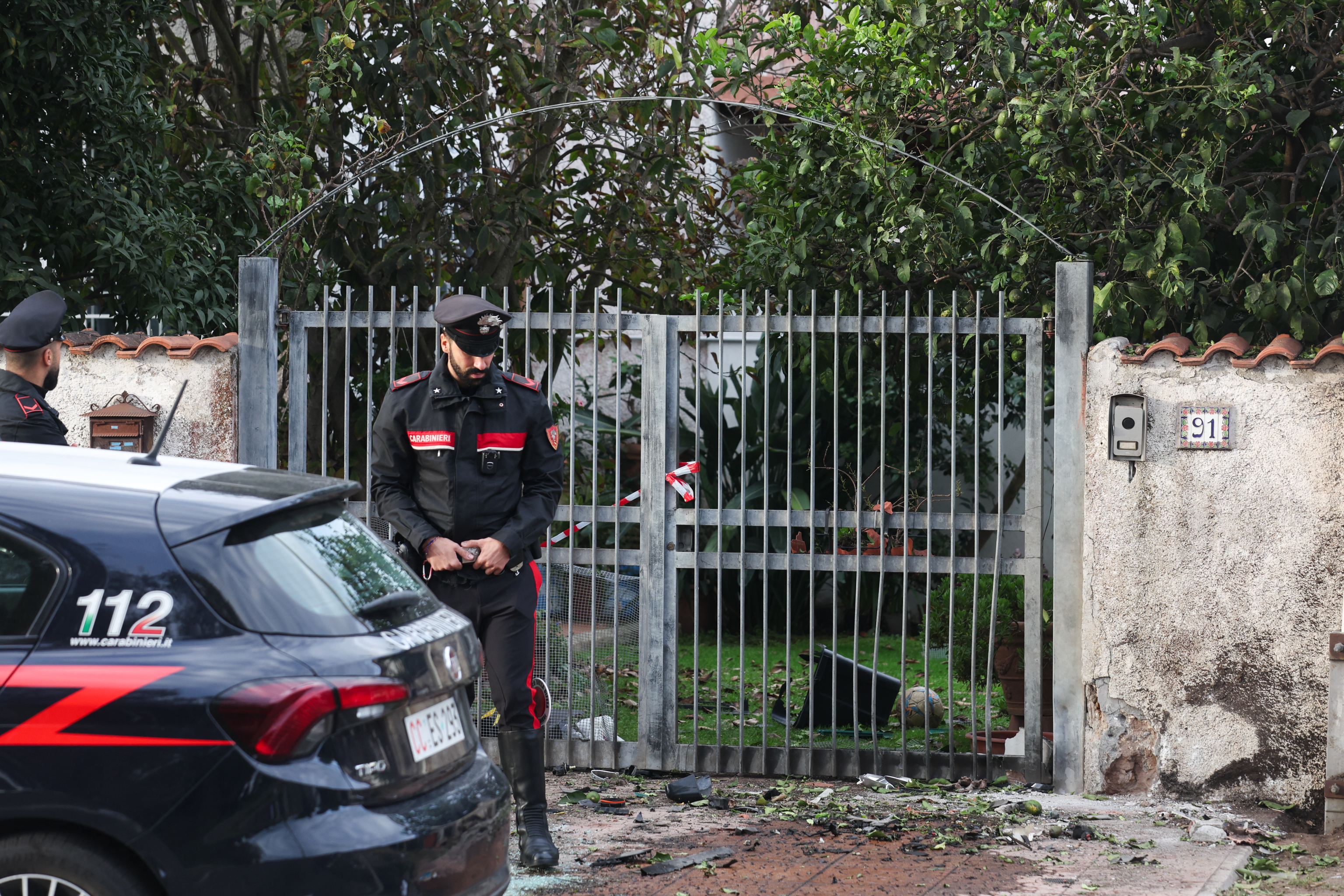 Italian Carabinieri stand guard in front of the residence of Italian journalist of TV investigative television news show 'Report'