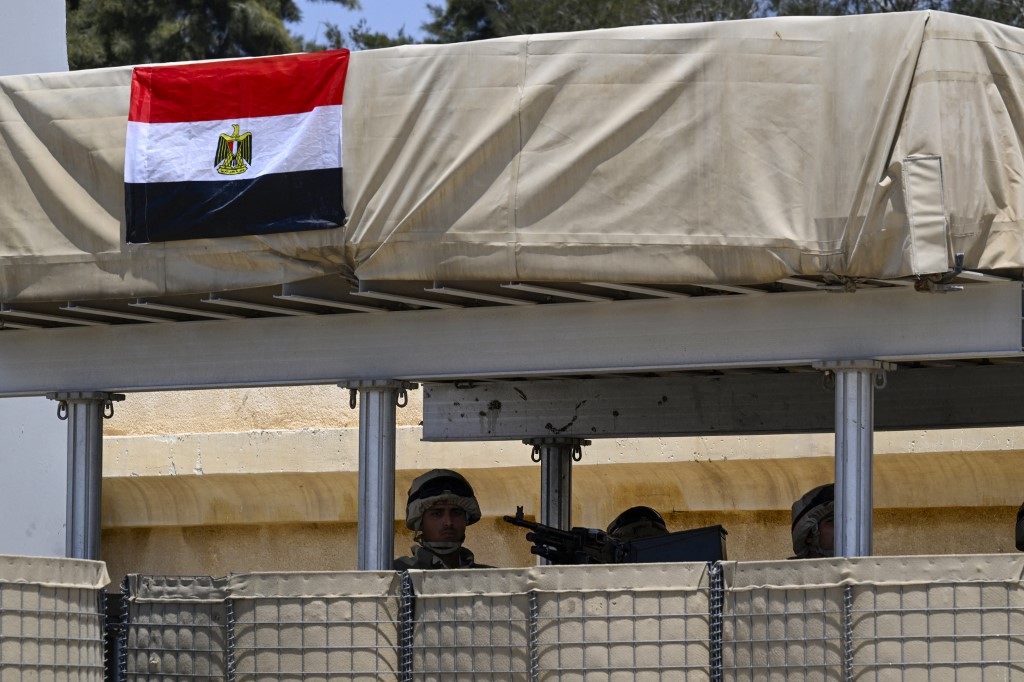 Soldiers man a post on the Egyptian side of the Rafah border crossi