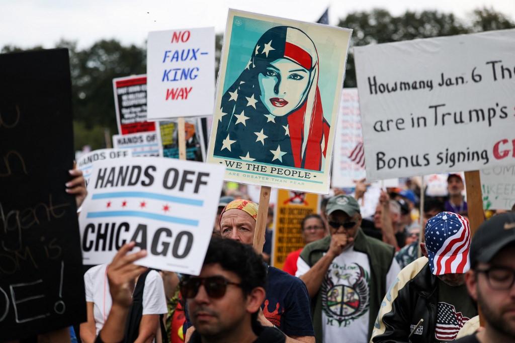 CHICAGO, ILLINOIS - OCTOBER 18: Protestors march in the second "No Kings"