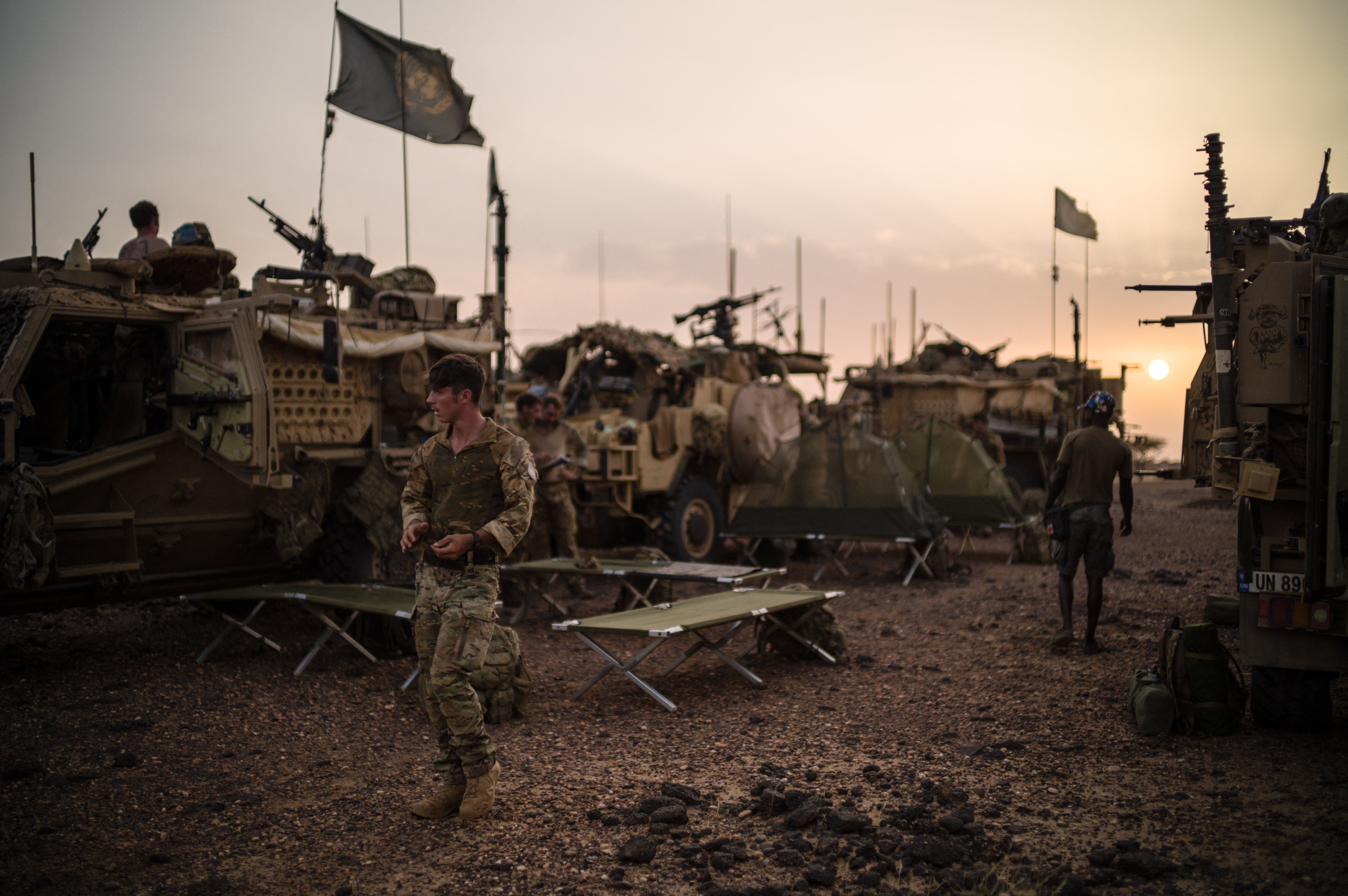 British Army soldiers from the United Nations Multidimensional Integrated Stabilization Mission in Mali (MINUSMA)'s Long Range Reconnaissance Group (LRRG) set up camp during a vigil in the desert, near Menaka, Mali, on October 26, 2021.