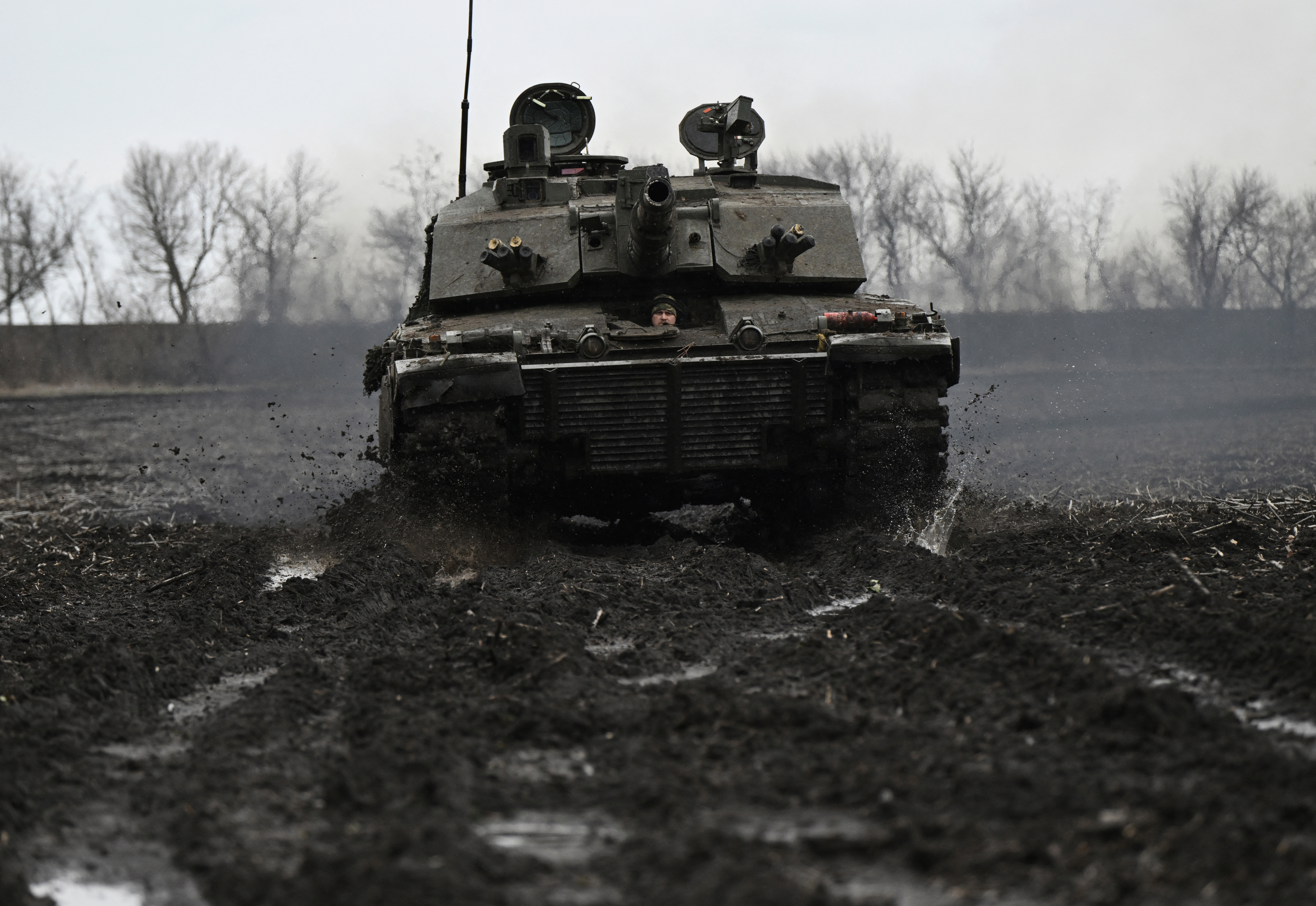 A Ukrainian serviceman of the 82nd Separate Air Assault Brigade prepares for combat Challenger 2 tank in an undisclosed location near frontline in Zaporizhzhia region