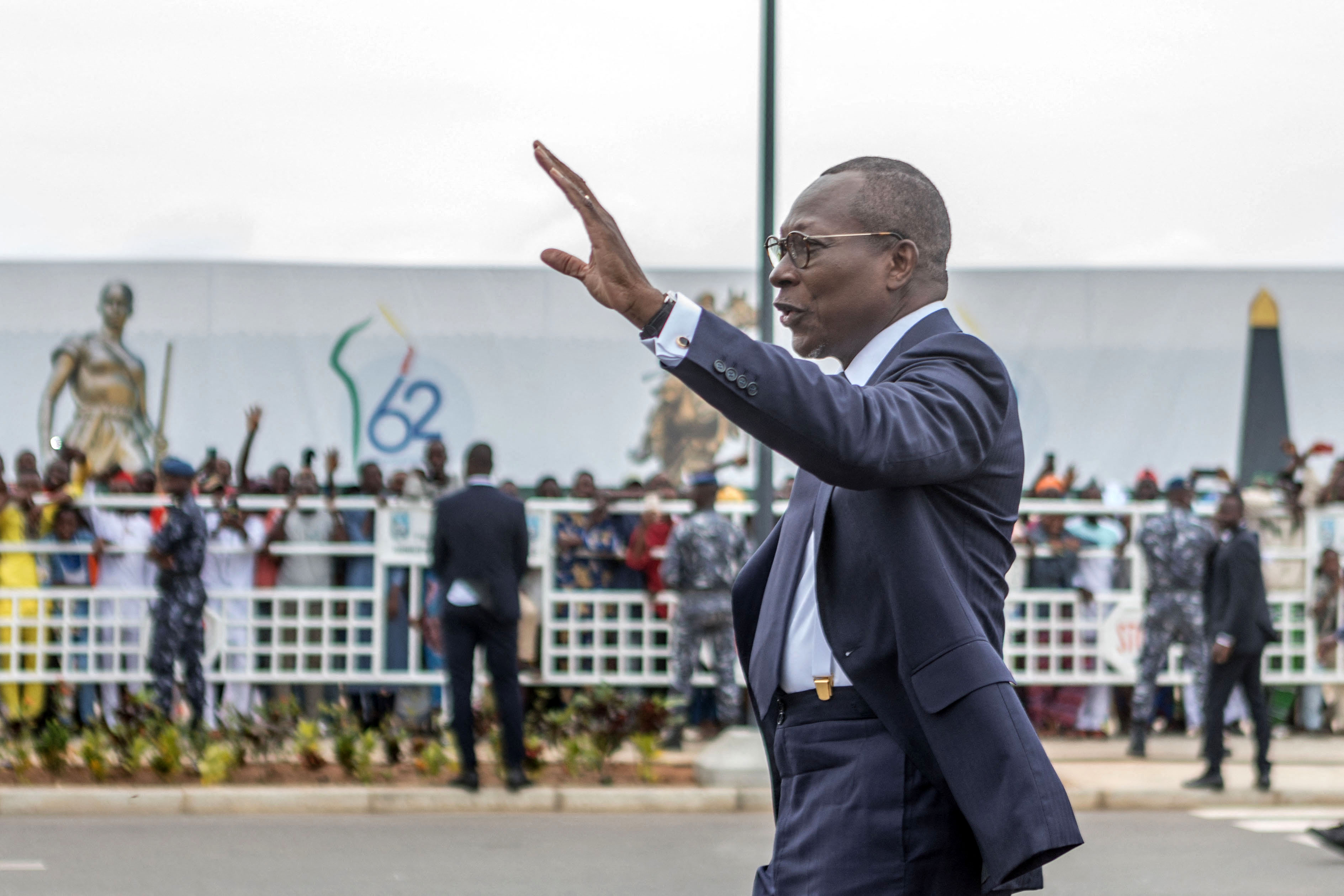 (FILES) Benin's president Patrice Talon waves on his arrival to inspect a guard of honour during the celebrations marking the 62nd independence anniversary in Cotonou