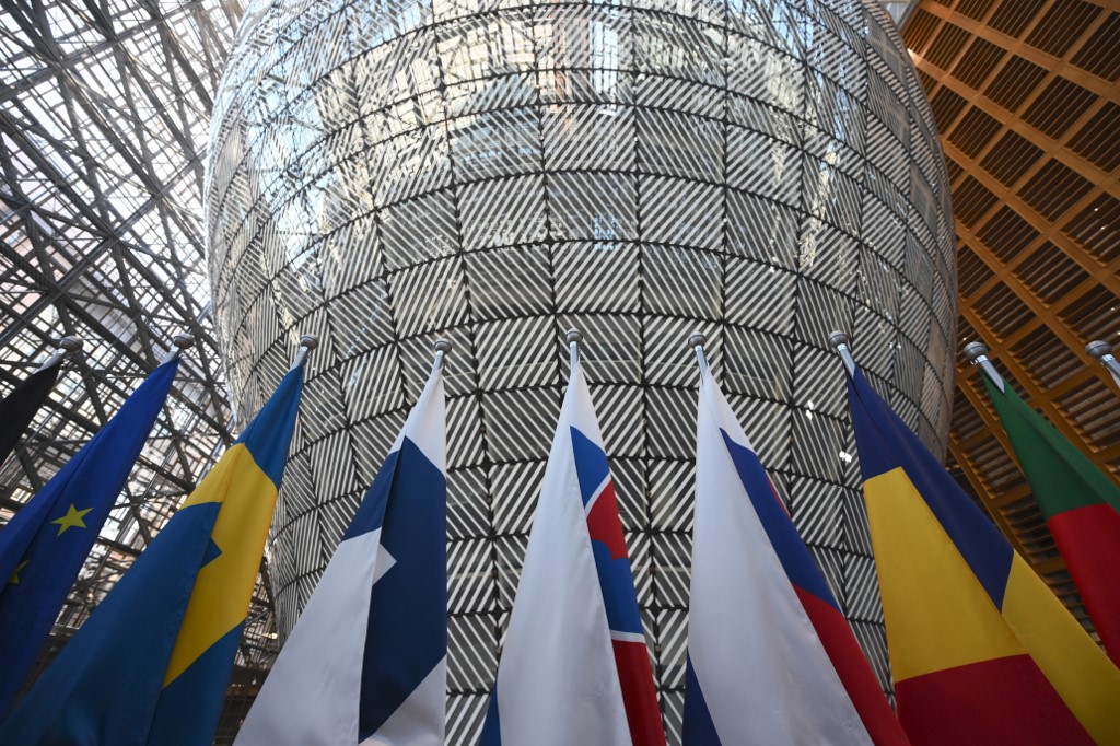 flags inside the Europa building, one of the European Council