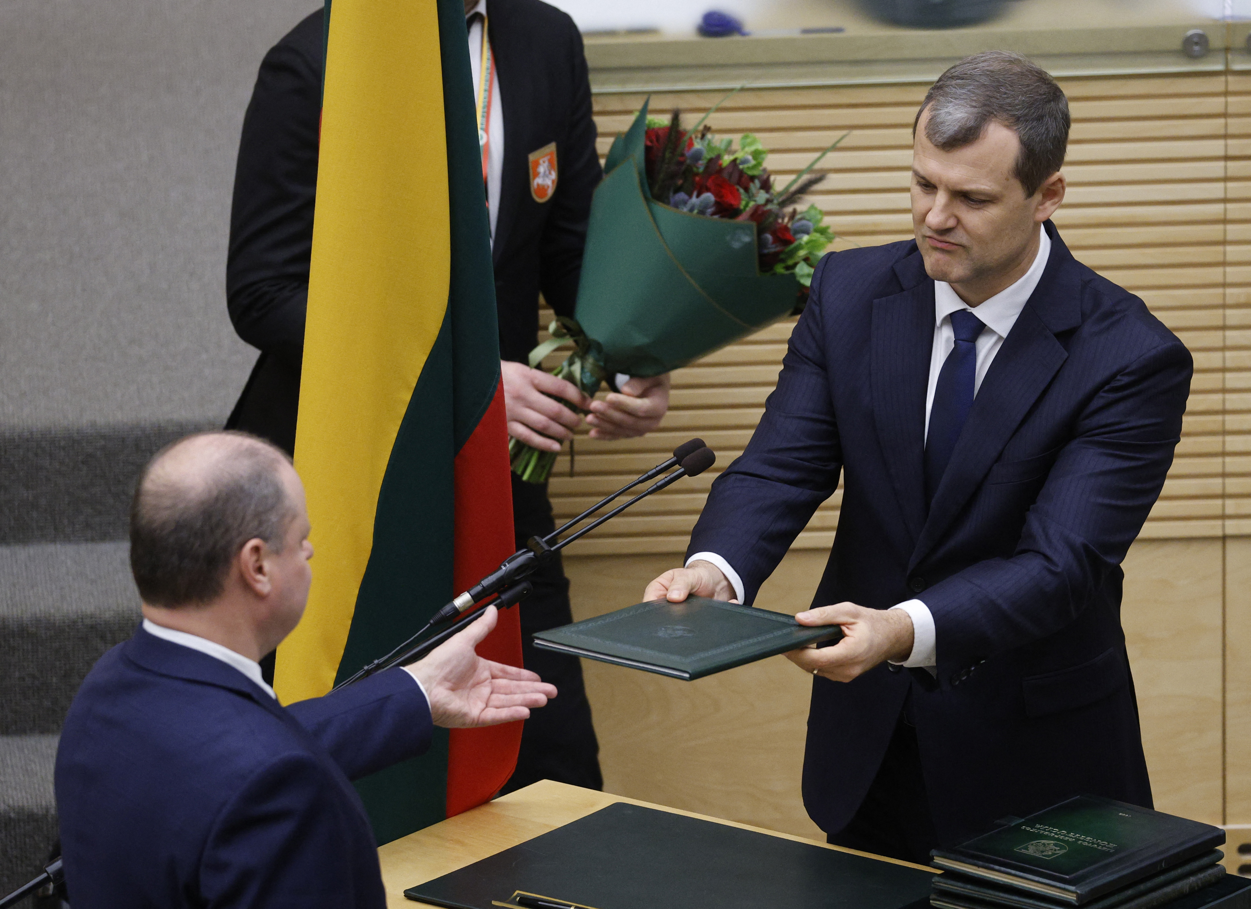 Lithuanian new Prime Minister Gintautas Paluckas is sworn-in during a session of the Seimas of the Republic of Lithuania
