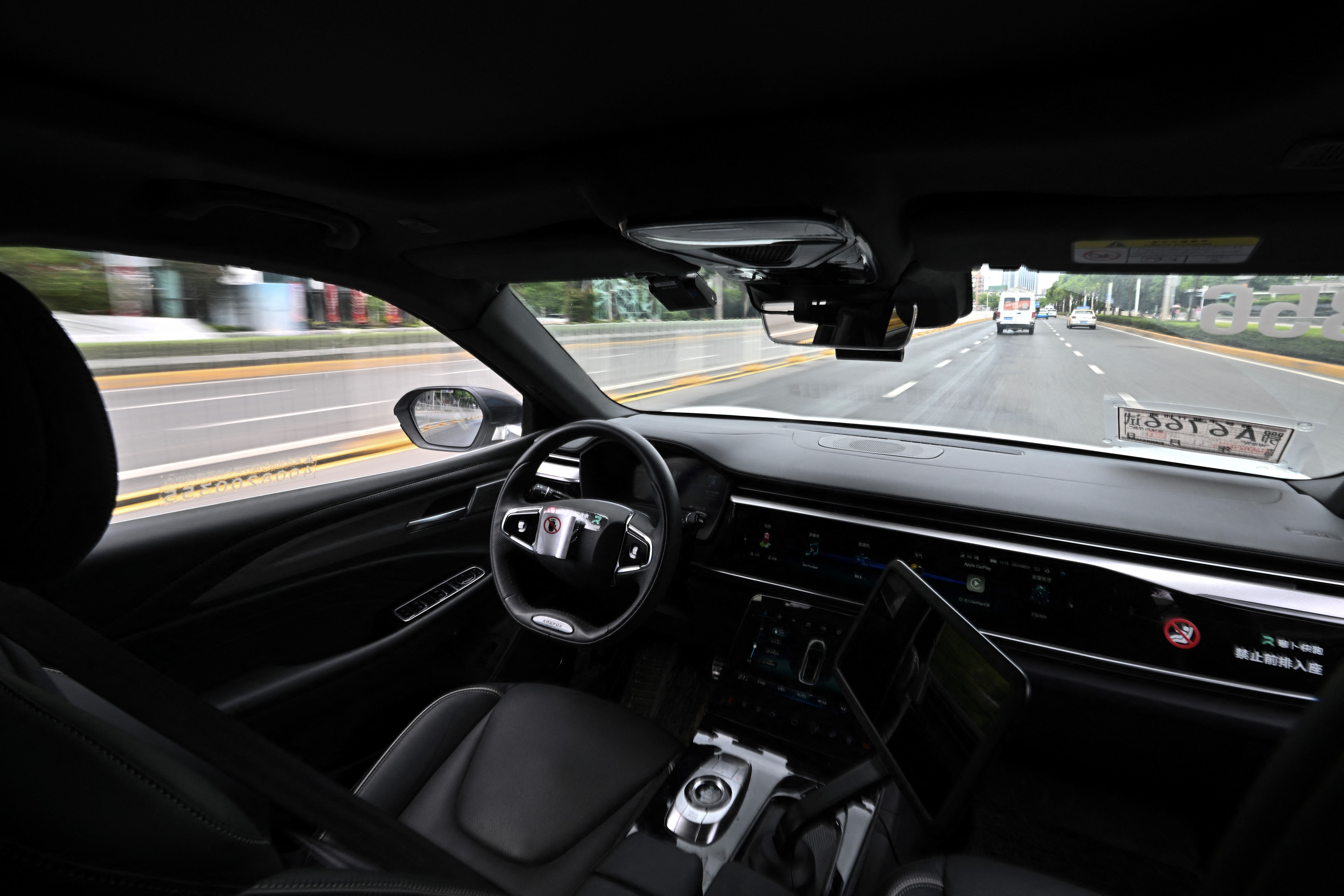 The photo taken on August 1, 2024 shows a general view of the driver's seat and controls of a driverless robotaxi