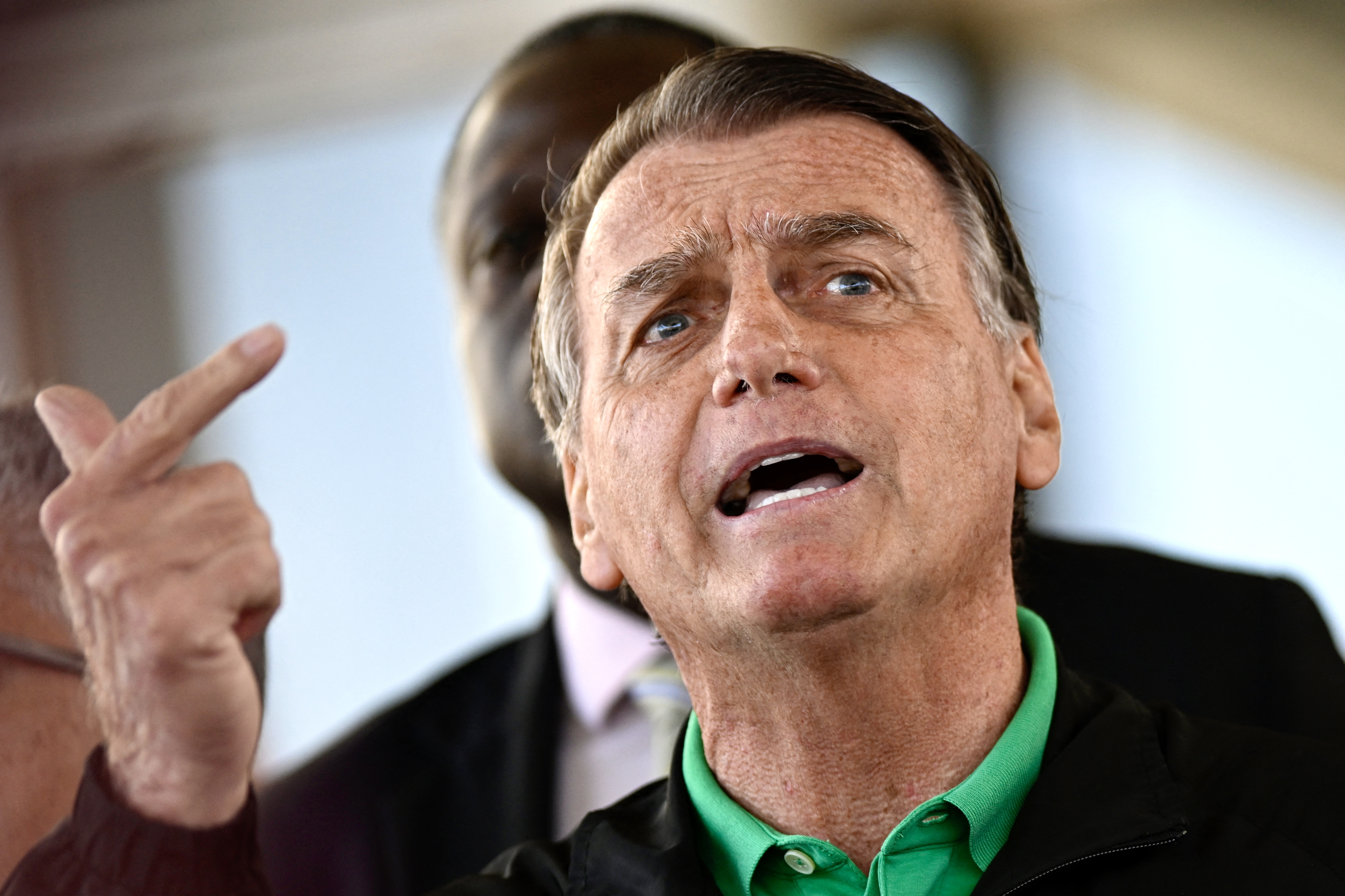 (FILES) Former Brazilian President Jair Bolsonaro speaks to the press at the Federal Senate in Brasilia on July 17, 2025.