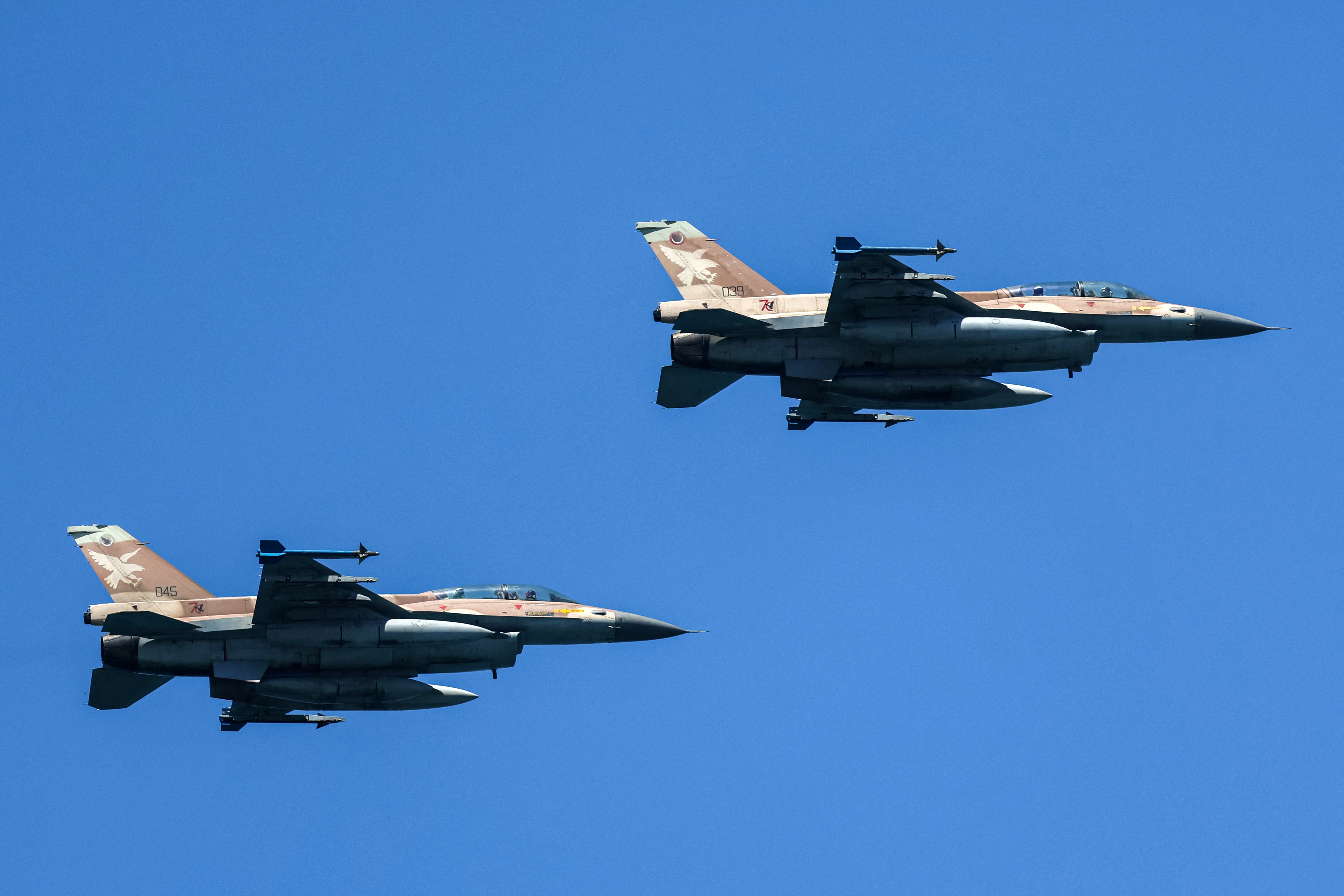 Israeli Air Force F-16 Falcon fighter aircraft fly over during an air show in Tel Aviv on April 26, 2023, as Israel marks Independence Day (Yom HaAtzmaut), 75 years since the establishment of the Jewish state. (Photo by JACK GUEZ / AFP)