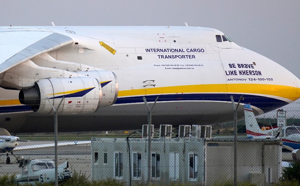 A Ukrainian Antonov AN-124 Cargo plane, bearing the message that reads "Be Brave like Kherson", is pictured at Larnaca International Airport on September 13, 2022. (Photo by Roy ISSA / AFP)
