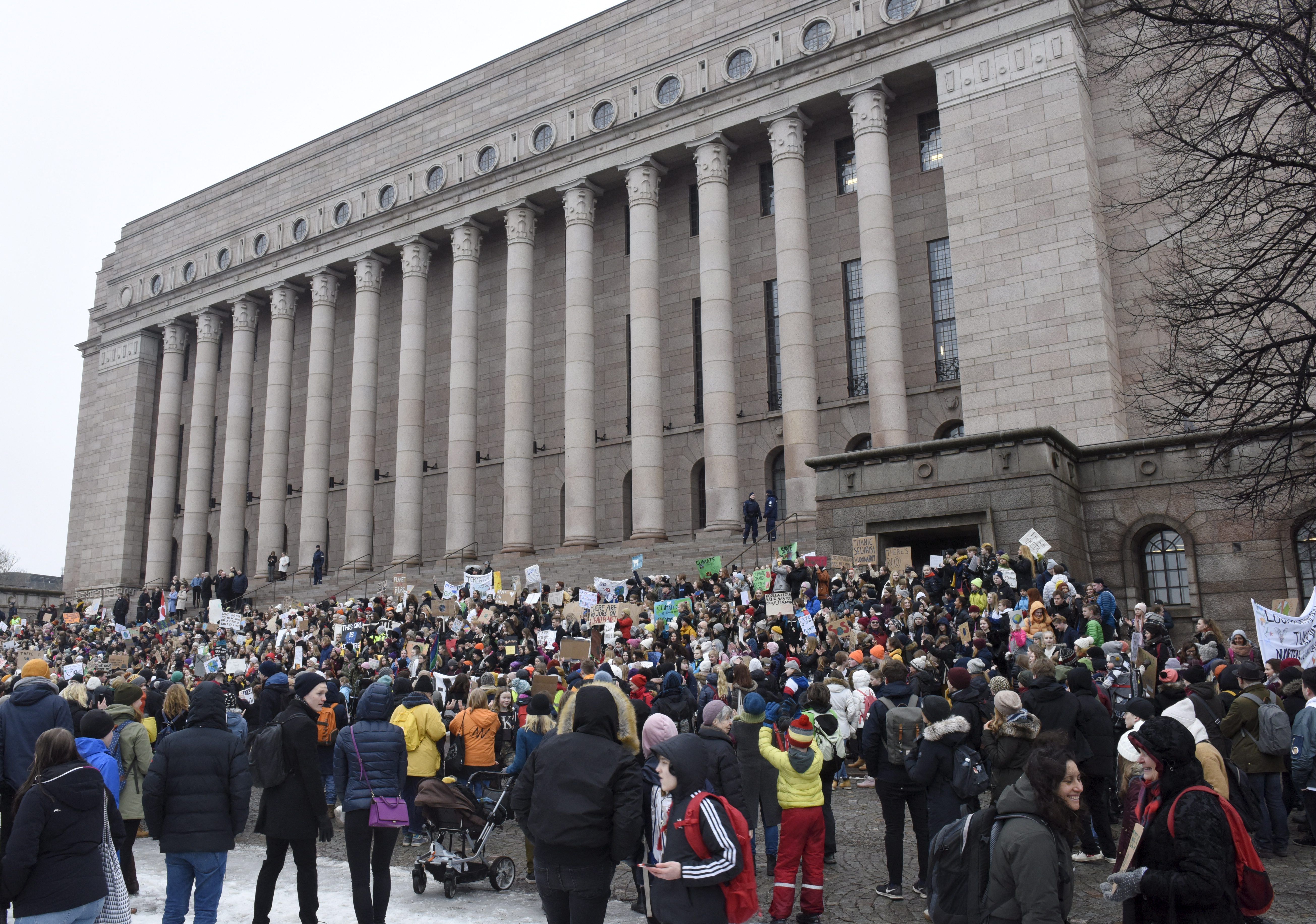 Young demonstrators gather at the Finnish Parliament during the protest march of Finnish youths calling for climate protection in Helsinki, on March 15, 2019. (Photo by Heikki Saukkomaa / Lehtikuva / AFP) / Finland OUT