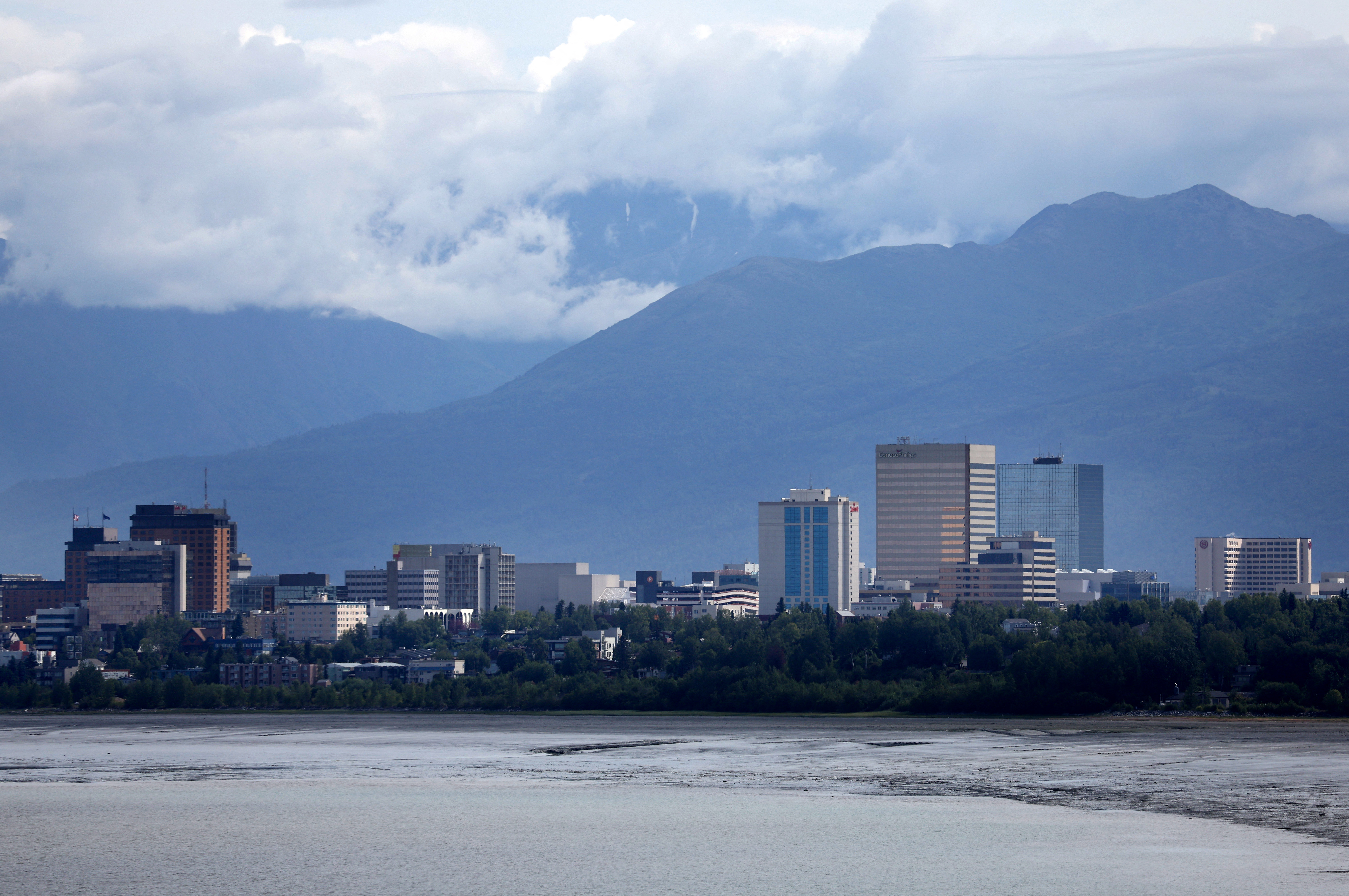 ANCHORAGE, ALASKA - JULY 10: A view of the downtown skyline with mountains in the rear on July 10, 2022 in Anchorage, Alaska.   Justin Sullivan/Getty Images/AFP (Photo by