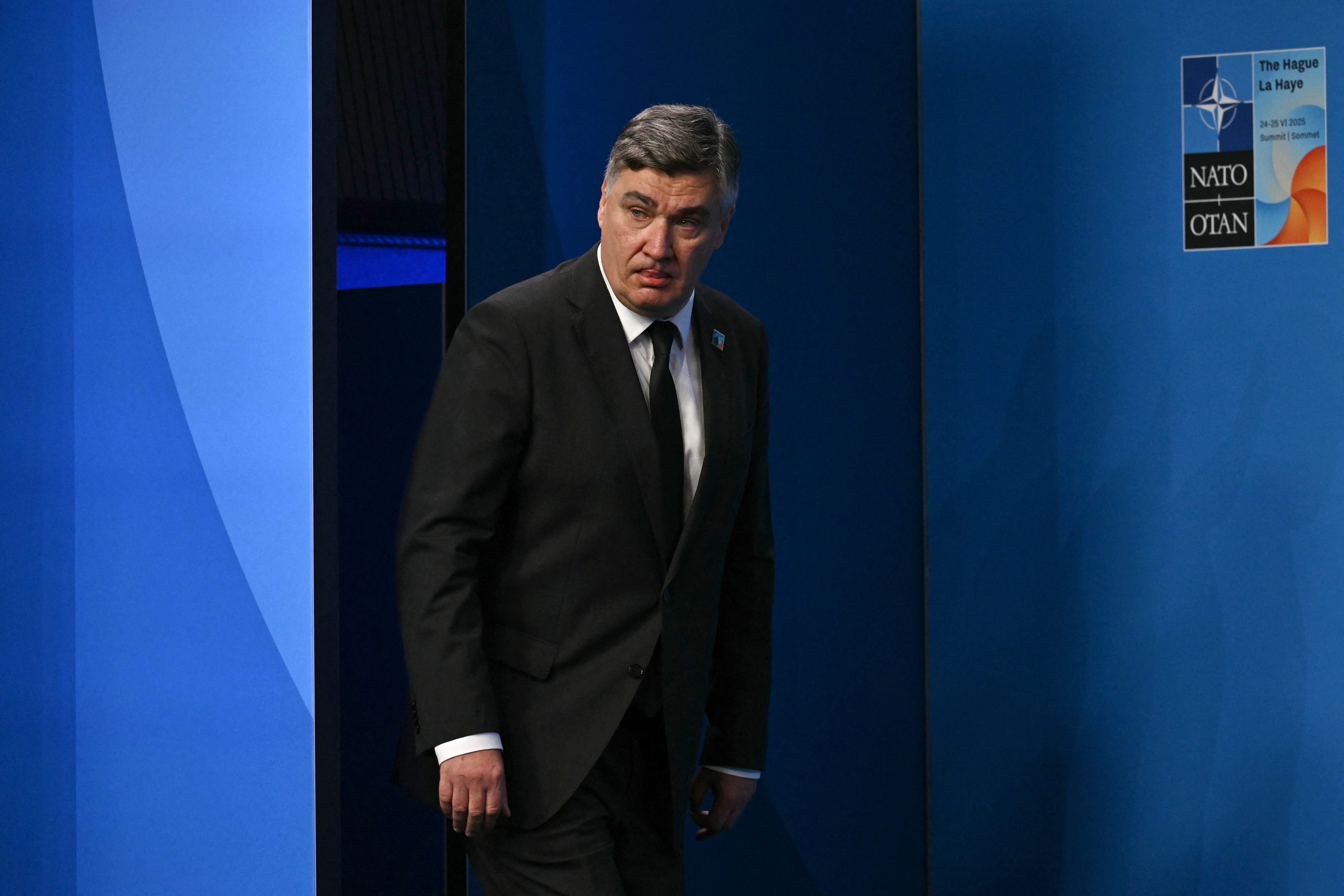 Croatia's President Zoran Milanovic arrives to pose for a photo with NATO Secretary General Mark Rutte and Netherlands' Prime Minister Dick Schoof (not in picture)