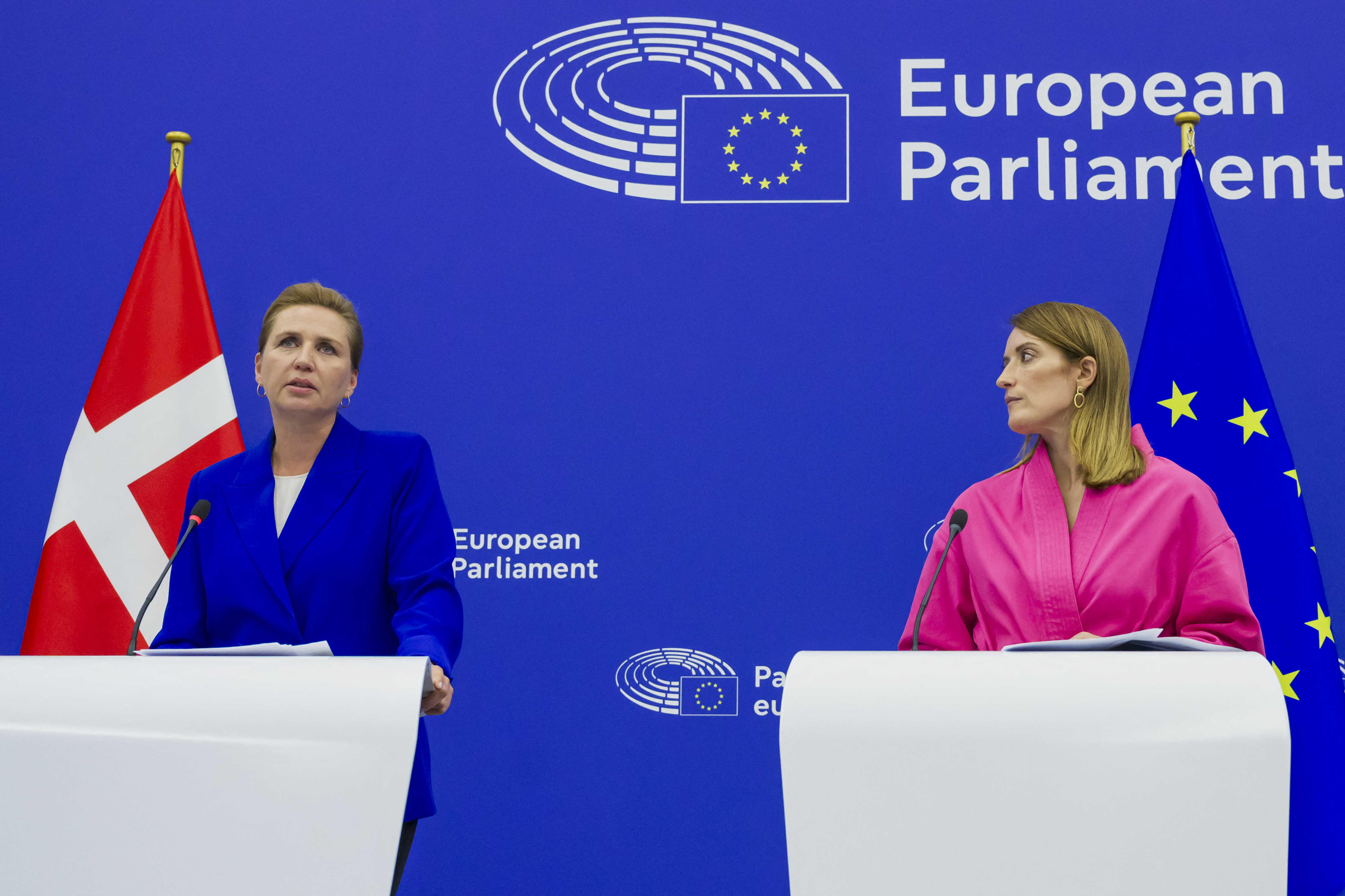 Danish Prime minister Mette Frederiksen (L) gives a press conference next to European Parliament President Roberta Metsola (R)