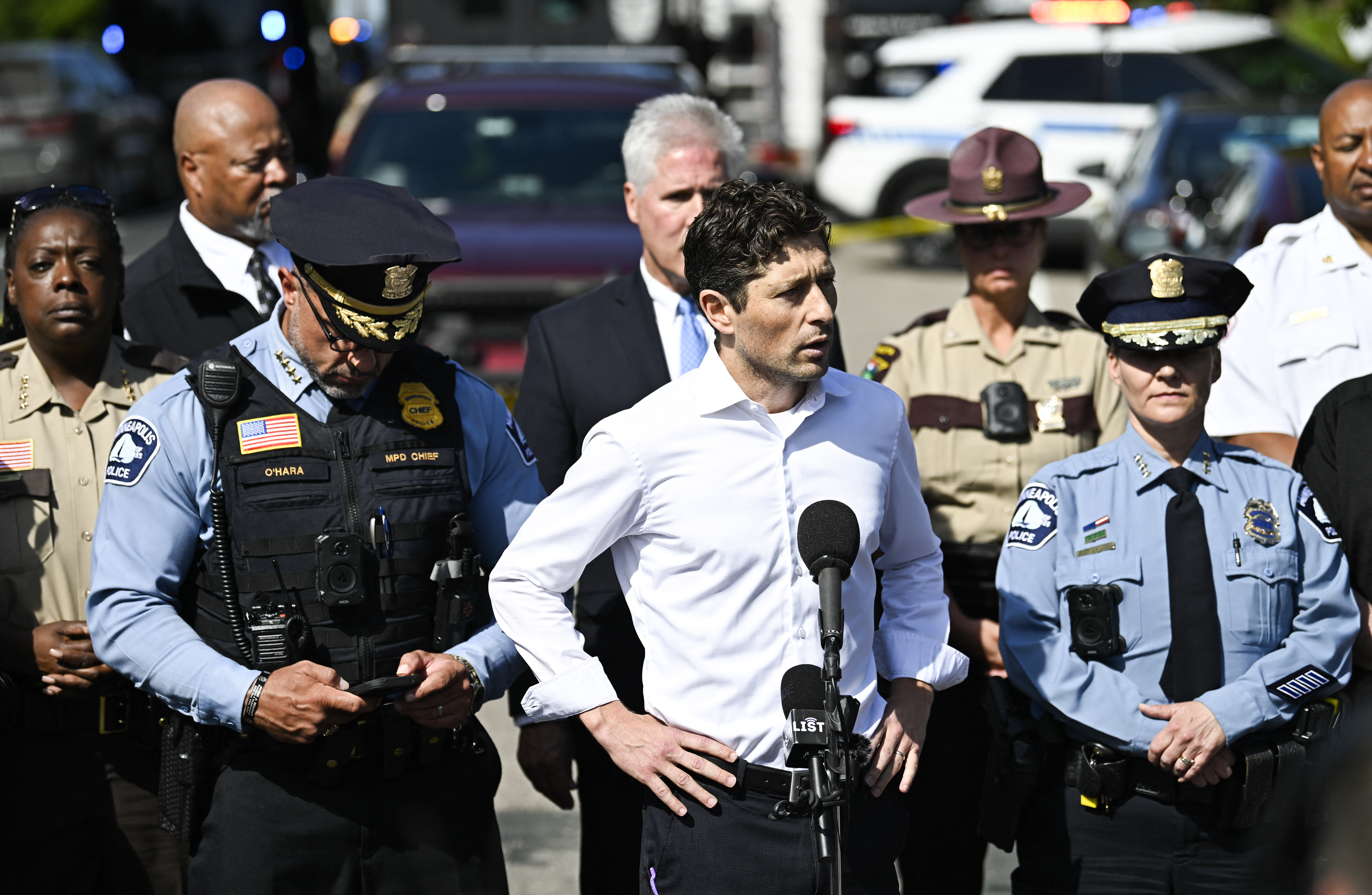 MINNEAPOLIS, MINNESOTA - AUGUST 27: Minneapolis Mayor Jacob Frey (C) speaks to the media following a mass shooting at Annunciation Catholic Church on August 27, 2025 in Minneapolis, Minnesota.