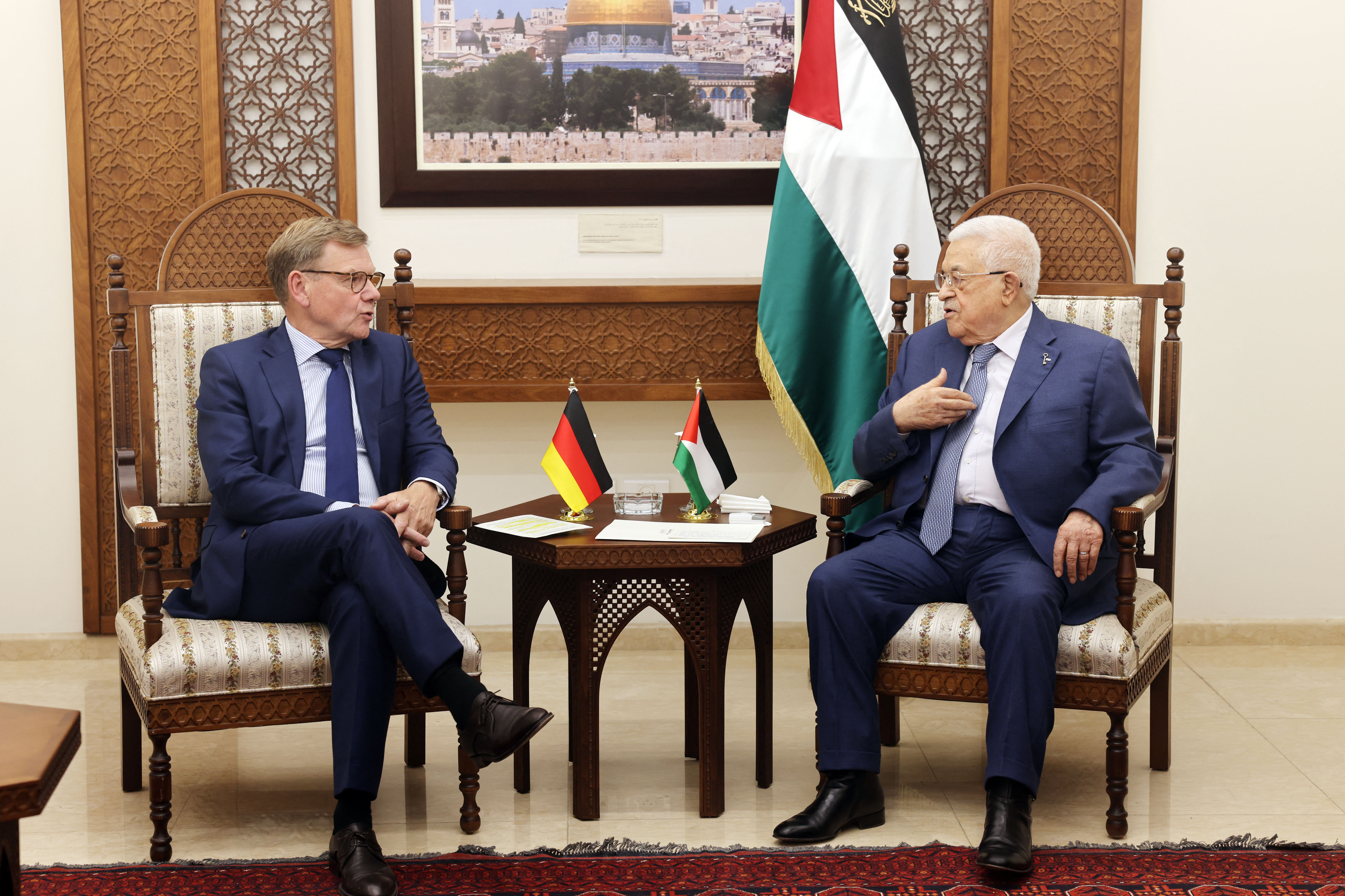 This handout picture released by the Palestinian press office (PPO) shows President Mahmud Abbas (R) meeting with German Foreign Minister Johann Wadephul in Ramallah in the Israel-occupied West Bank
