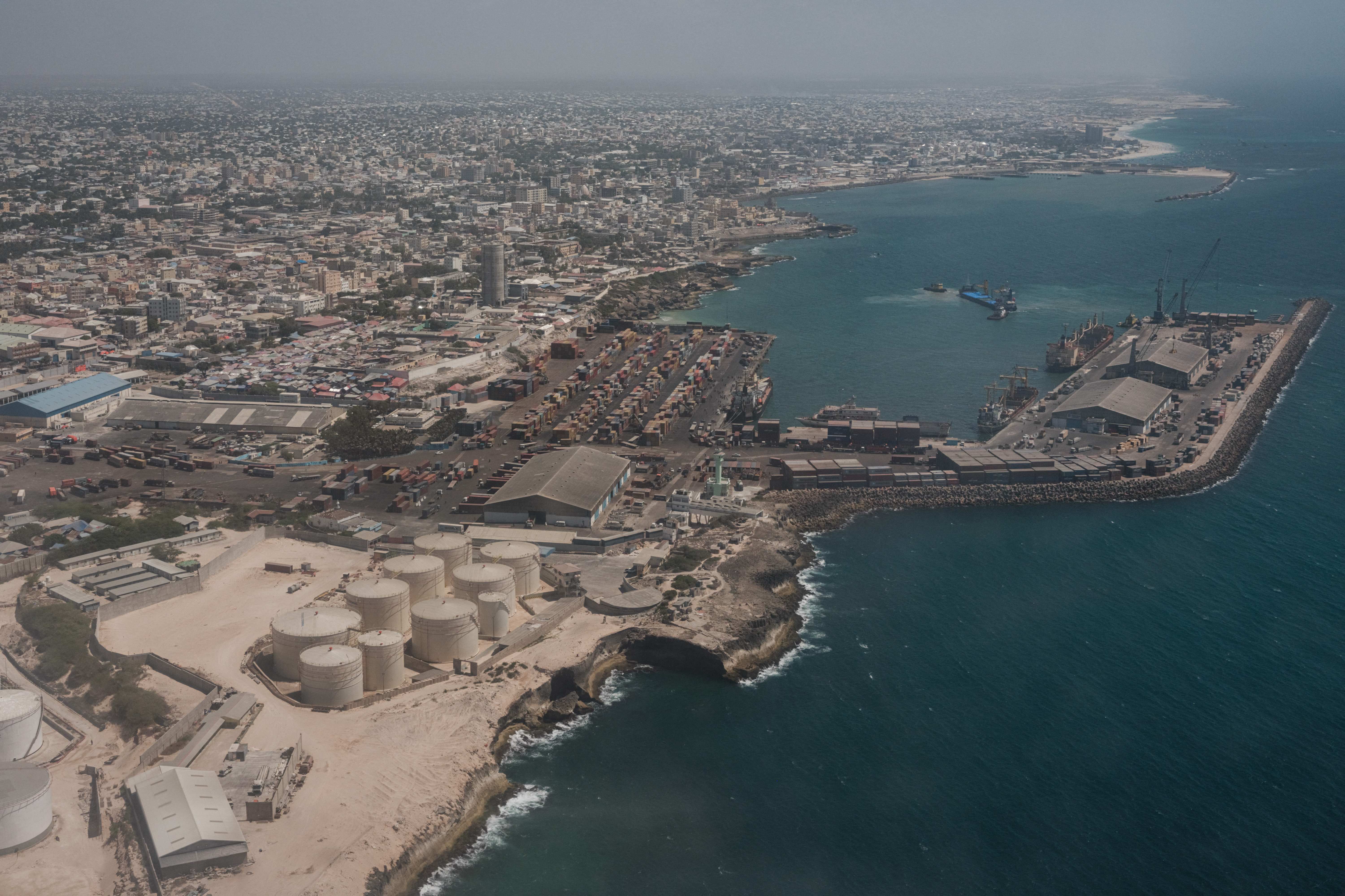 An aerial view of the port in Mogadishu, Somalia, on February 15, 2022. (Photo by YASUYOSHI CHIBA / AFP)