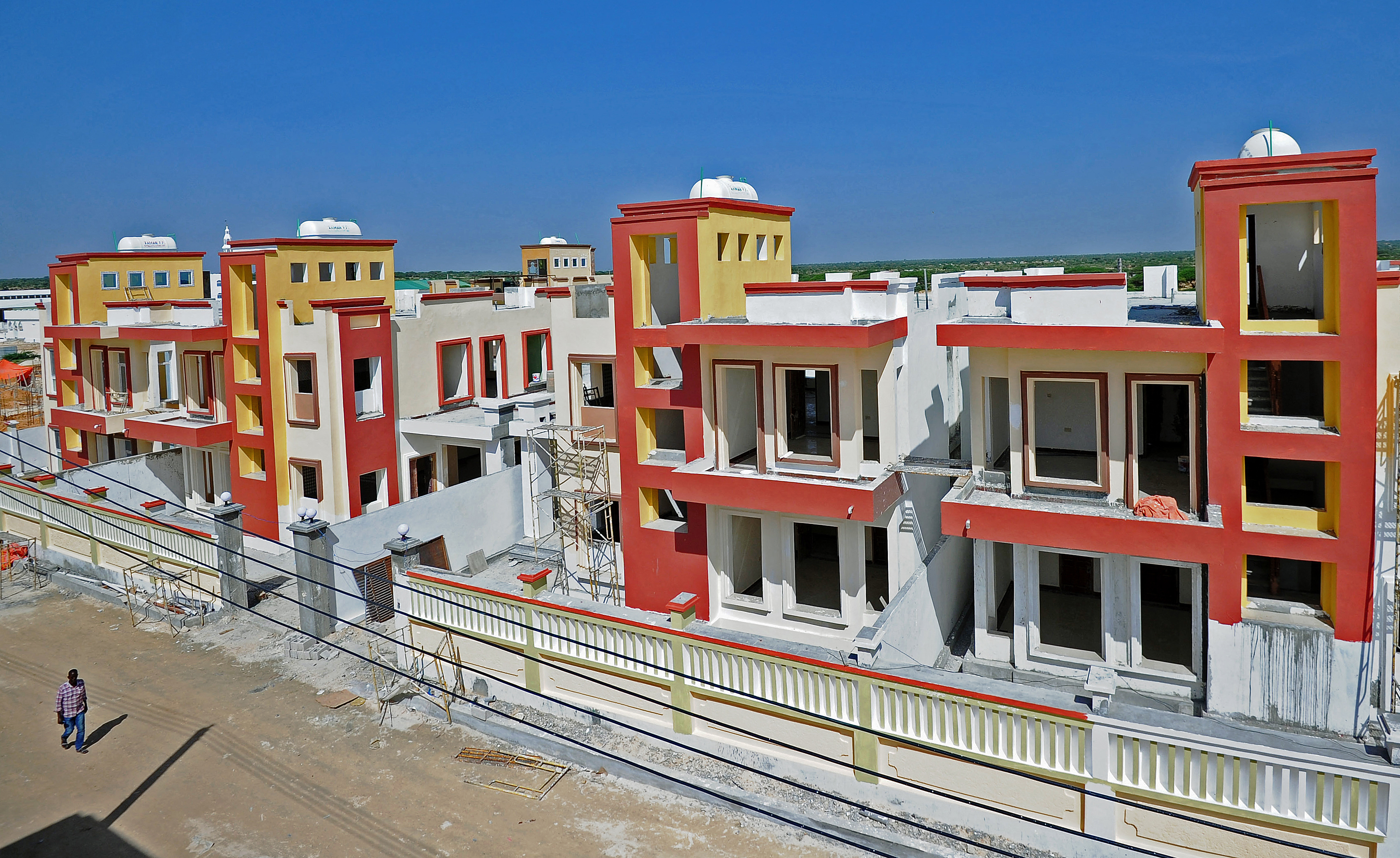 A man walks through Daru Salaam city,