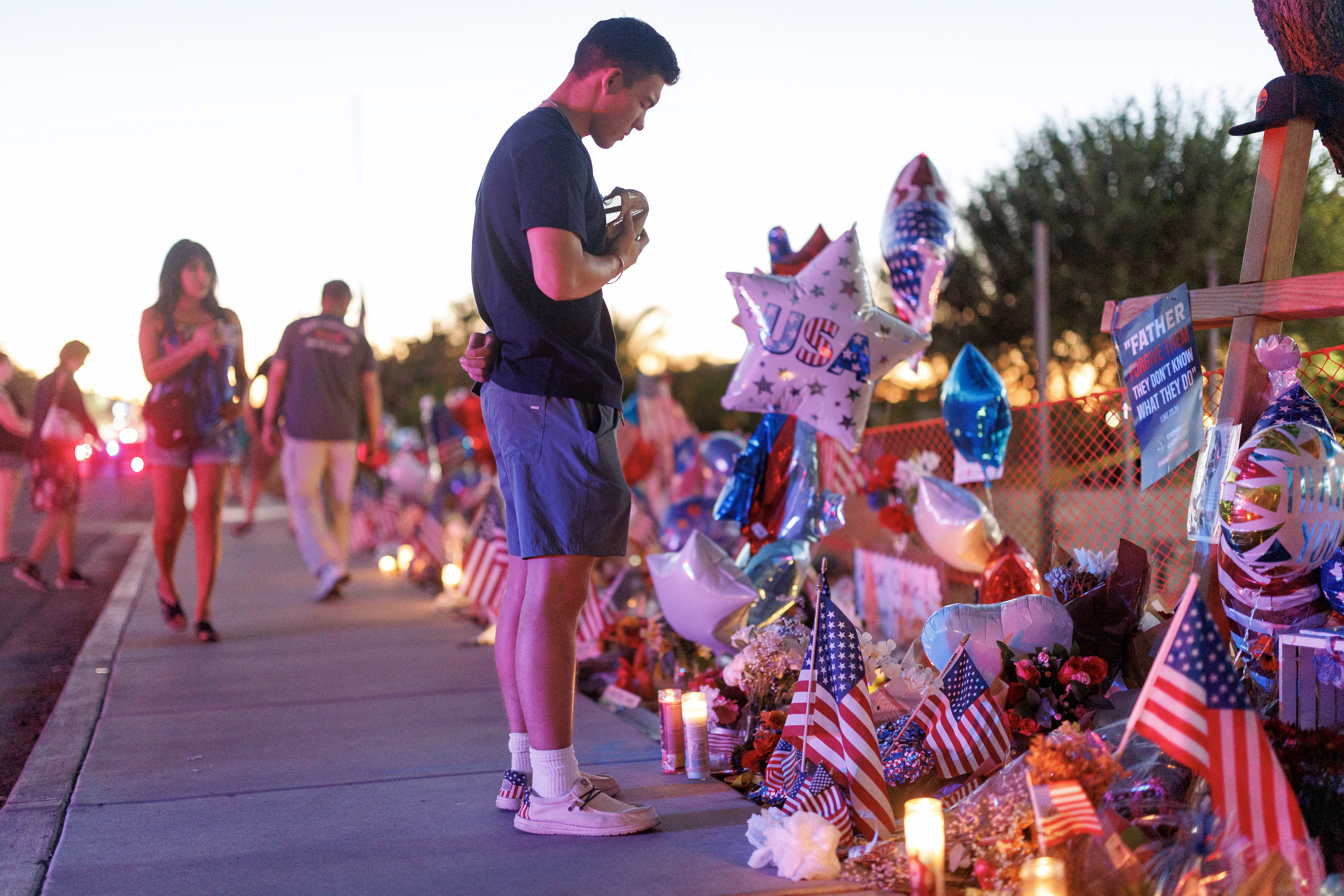 People visit a memorial for Charlie Kirk at the headquarters of Turning Point USA on September 14, 2025 in Phoenix, Arizona.
