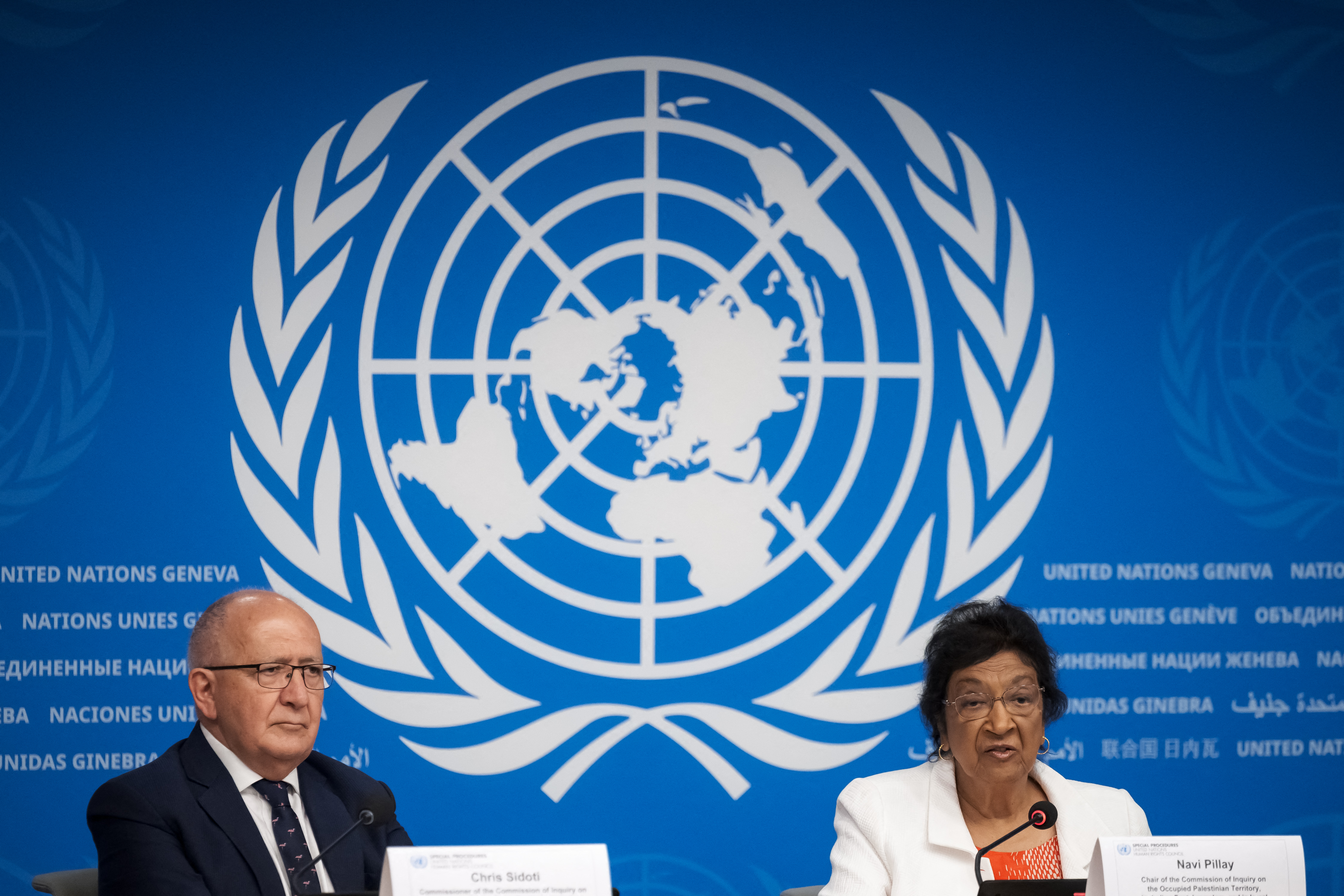 Chair of the Independent International Commission of Inquiry on the Occupied Palestinian Territory, including East Jerusalem, and Israel, South African judge Navi Pillay (R) speaks next to member of the Independent International Commission of Inquiry