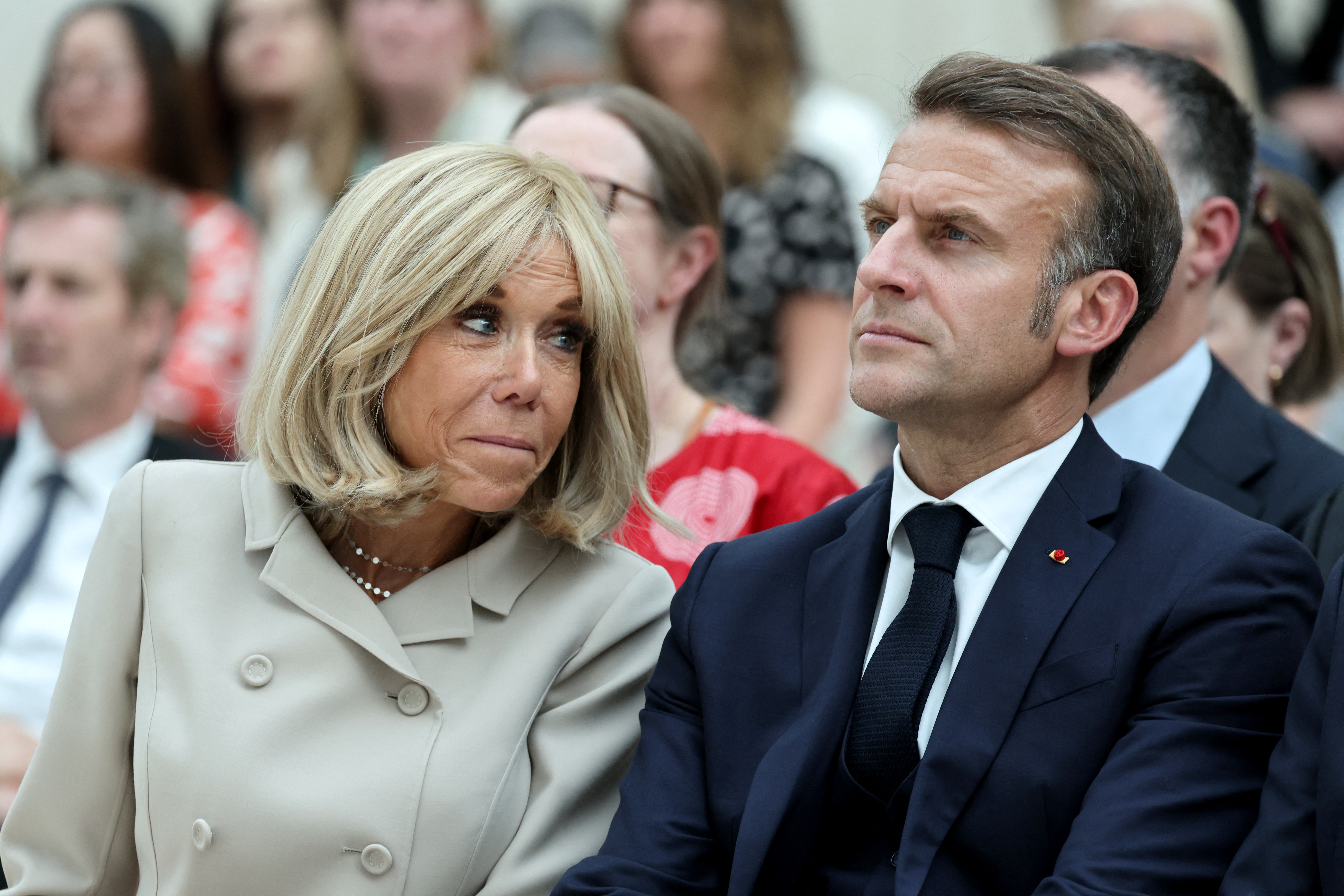 France's President Emmanuel Macron and his wife Brigitte Macron attend a ceremony during their visit to The British Museum in London on July 9, 2025, during the second day of a three-day state visit to Britain. (Photo by Ludovic MARIN / POOL / AFP)