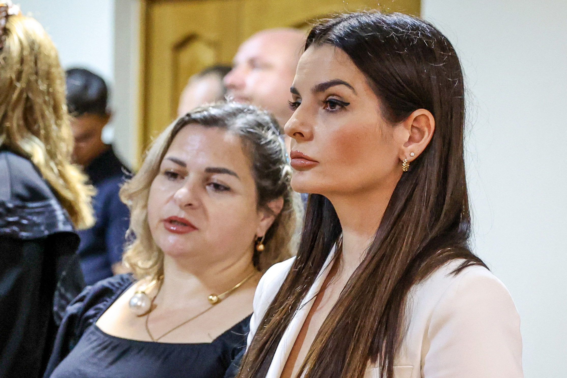 The pro-Russian governor of Moldova's Gagauzia region, Evghenia Gutul (R), listen to her sentence pronounced by a judge in the courtroom, in the Modovan capital Chisinau on August 5, 2025.