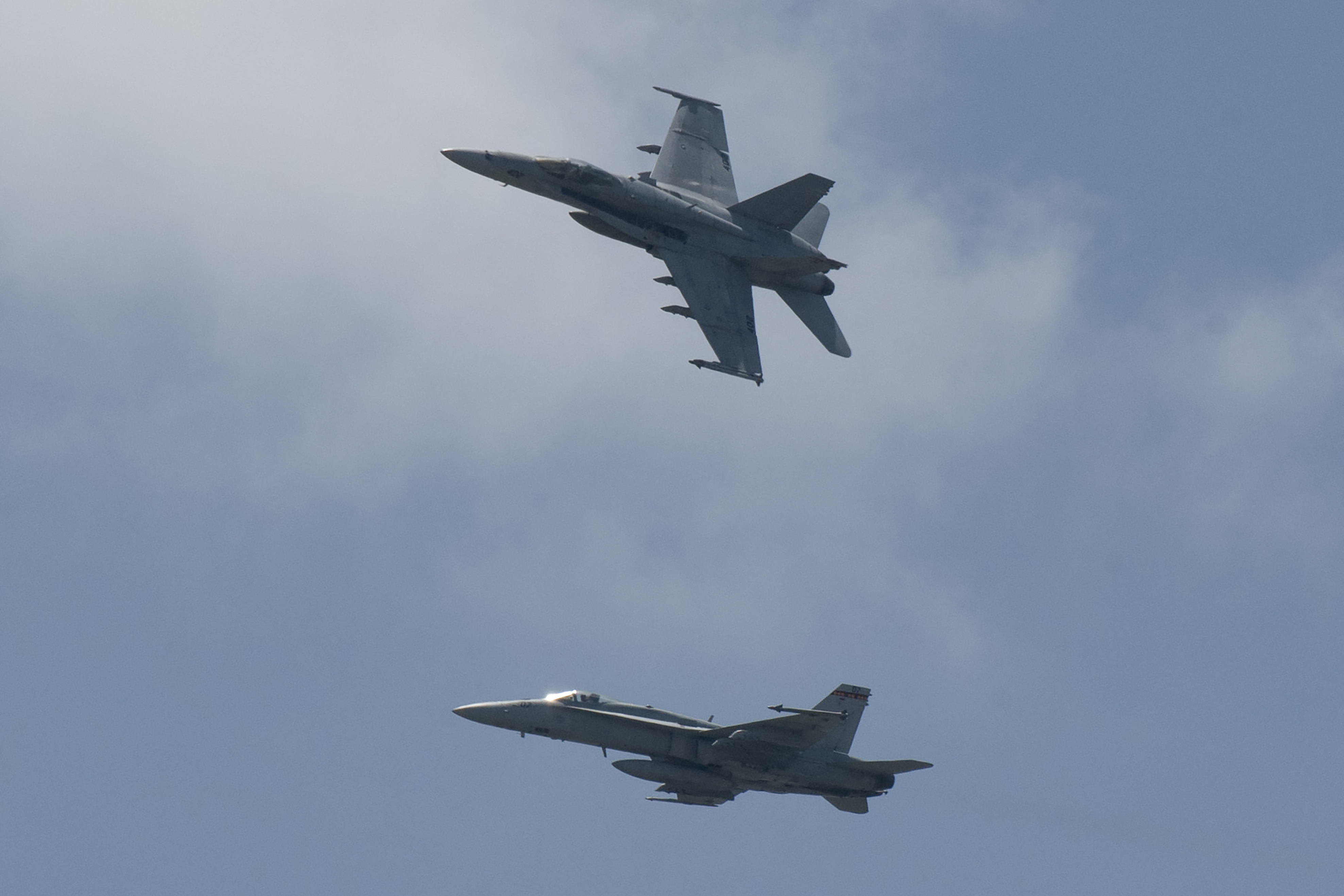 Two US F/A-18 Hornet jet fighters manuever during the opening ceremony of Cope Thunder, an annual bilateral exercise between the US Pacific Air Forces and the Philippine Air Force, Photo by )